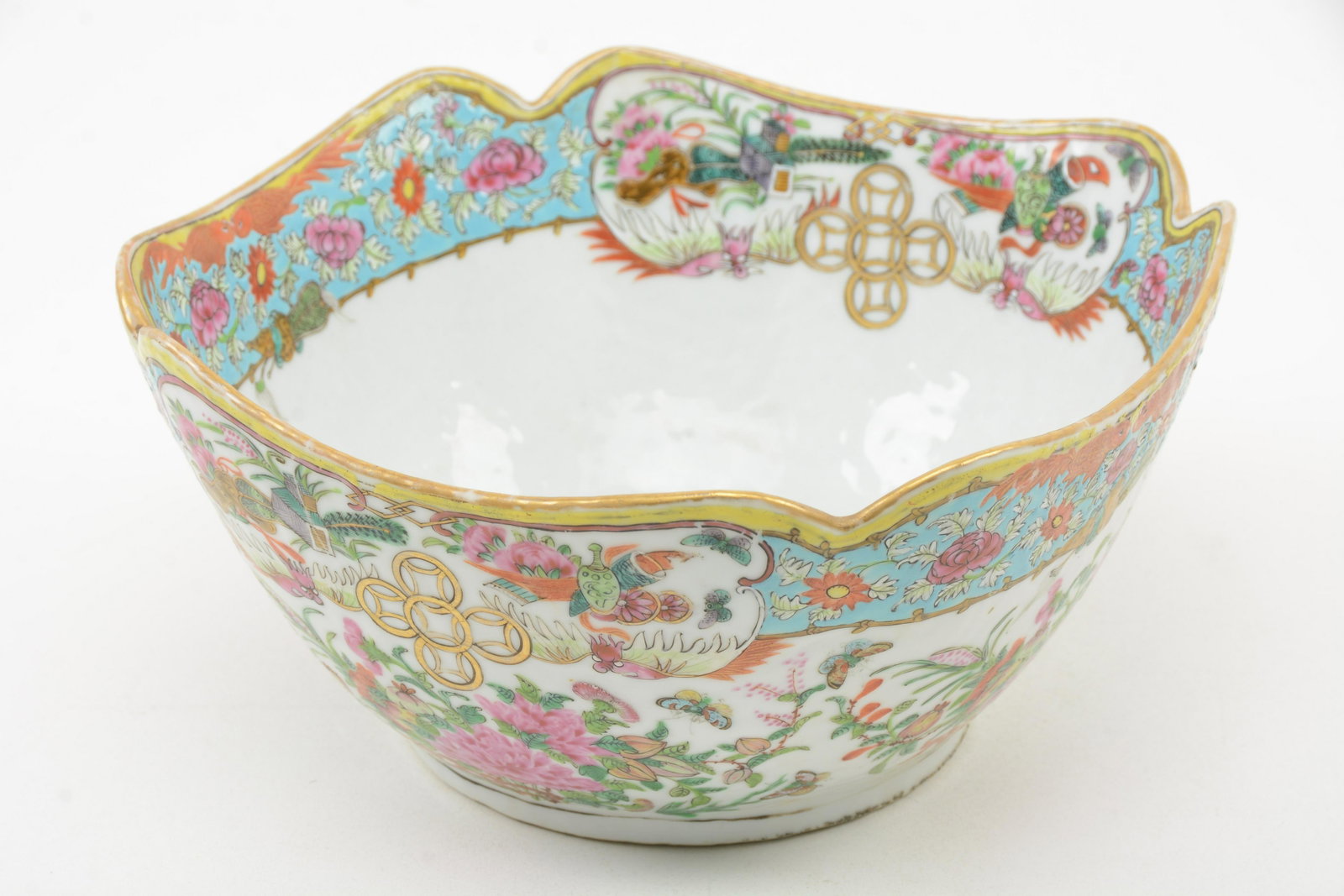 19th Century Chinese Famille Rose Porcelain Bowl: 19th century Chinese Famille Rose porcelain cut corner bowl. Goldfish, floral and Buddhist symbol decoration. Wear to top rim .