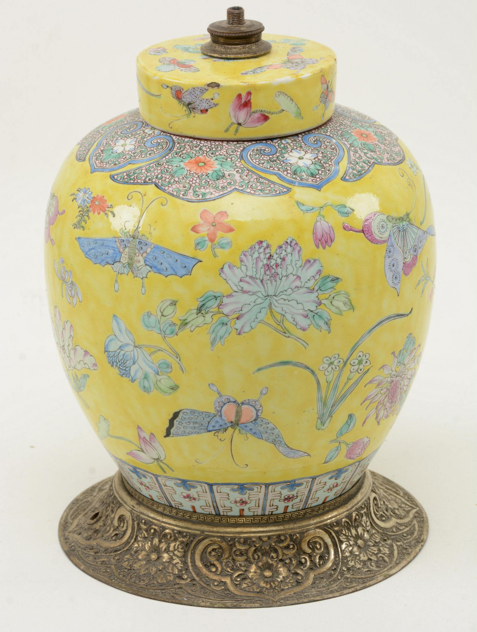 Chinese Yellow Famille Rose Covered Jar. With flared: Yellow Famille Rose Covered Jar. With flared, embossed metal stand. Formerly fitted as lamp. Other wear consistent with age and use. 12.5” high.