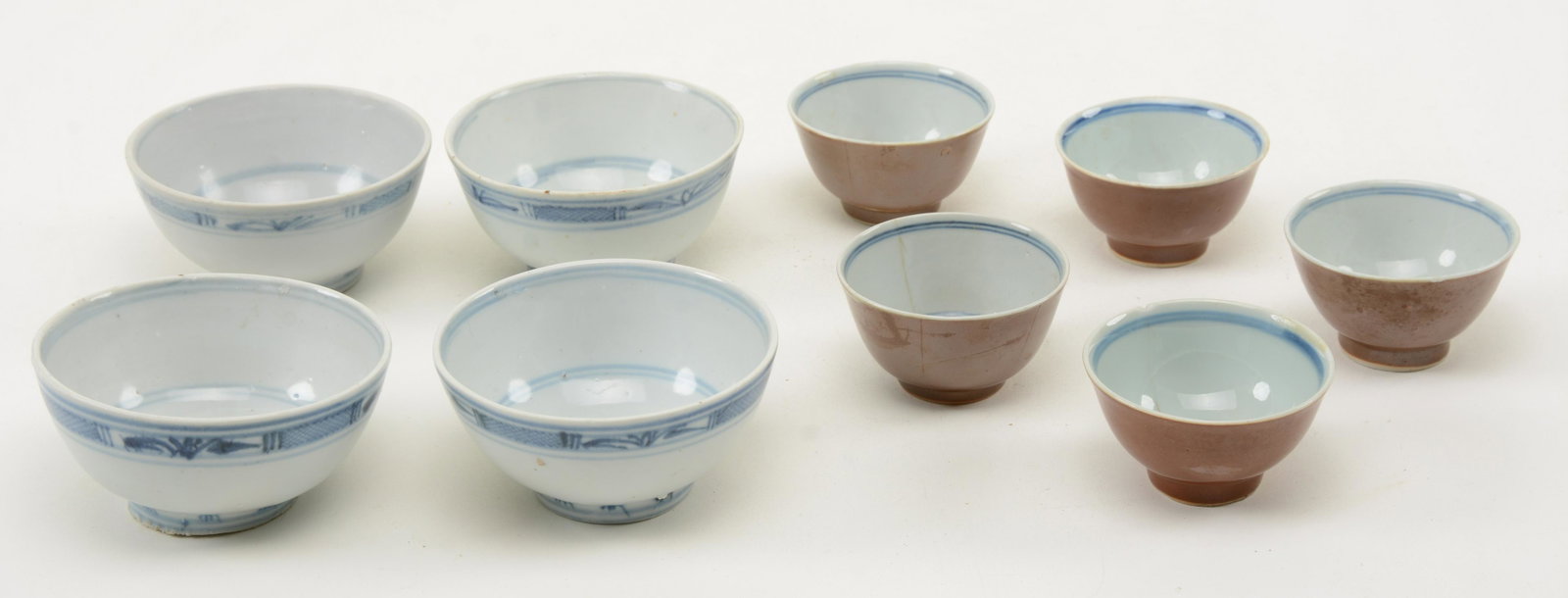 Blue and White Decorated Chinese Porcelain Bowls. [4]: Blue and White Decorated Chinese Porcelain Bowls. [4] bowl set together with [5] smaller bowls or cups with brownish-red exterior. Chips and hairline cracks to some smaller bowls, minor edge chips to 