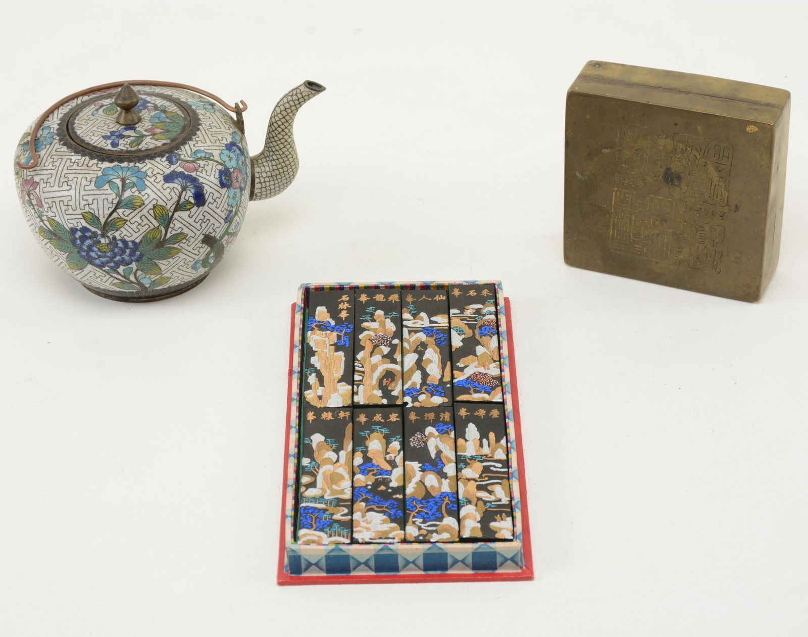 Chinese Decorative Objects. Lot of [3] items includes: Chinese Decorative Objects. Lot of [3] items includes cloisonnÃ© teapot, ink cakes and decorative brass container. Handle on teapot missing attachment at one side. Teapot measures 3.75” high.