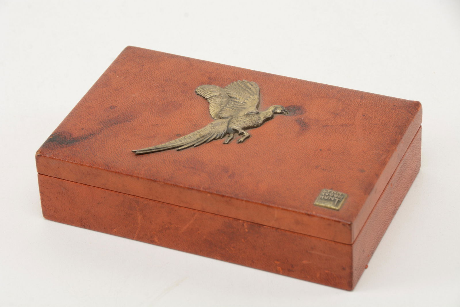 Lynn Bogue Hunt Sterling Silver Embellished Cigar Box.: Lynn Bogue Hunt Sterling Silver Embellished Cigar Box. Leather bound. Light scuffs to surface with minor cracking along hinge. 6.75” wide.