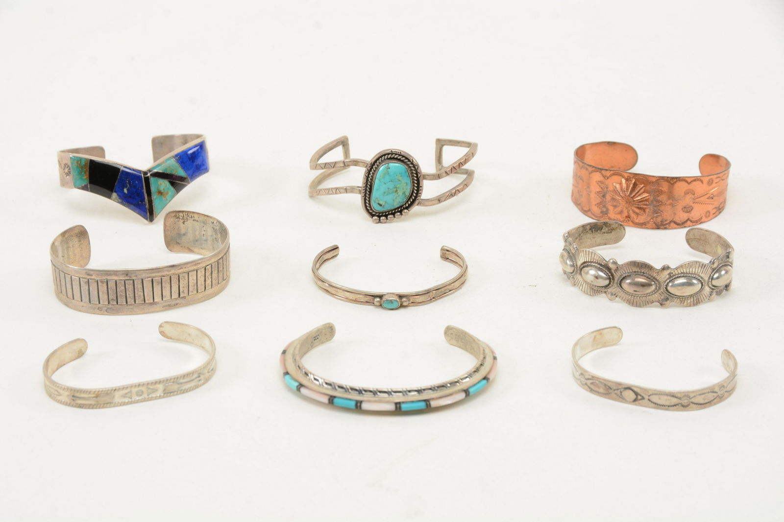 Southwestern Sterling and Silver Cuff Bracelets. Lot of (1 of 9)