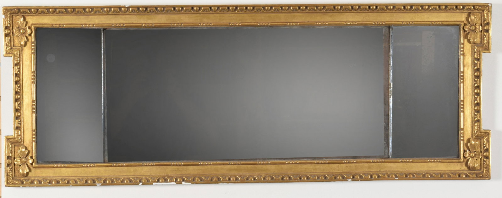 Regency carved and gilt gesso over mantle mirror, circa: Regency carved and gilt gesso over mantle mirror, circa 1820. Egg and dart border with outset rosettes around three beveled mirror glasses. Ex. Sack collection, vol. 4, p. 994, pl. P3786; Northeast Au
