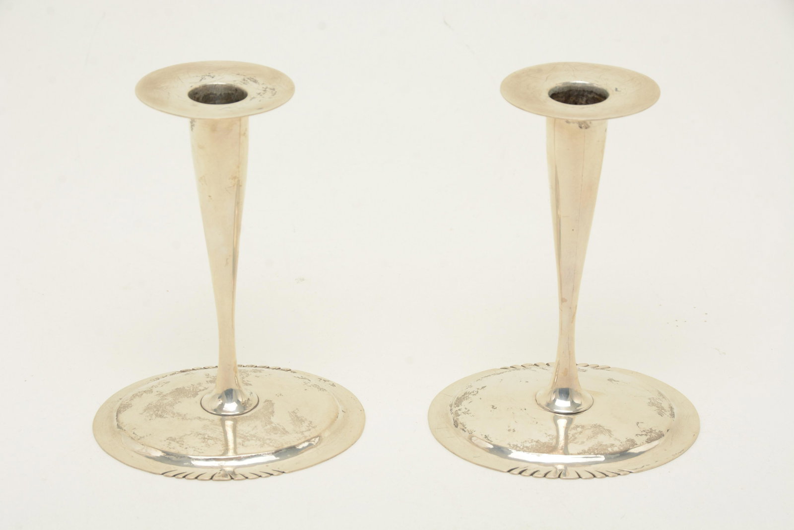 Daniel Reese sterling silver Arts & Crafts: Daniel Reese sterling silver Arts & Crafts candlesticks, pair, Boston. Elliptical bases with cut designs on two edges. See Ulehla's "The Society of Arts and Crafts, Boston Exhibition Record 1897-1927"