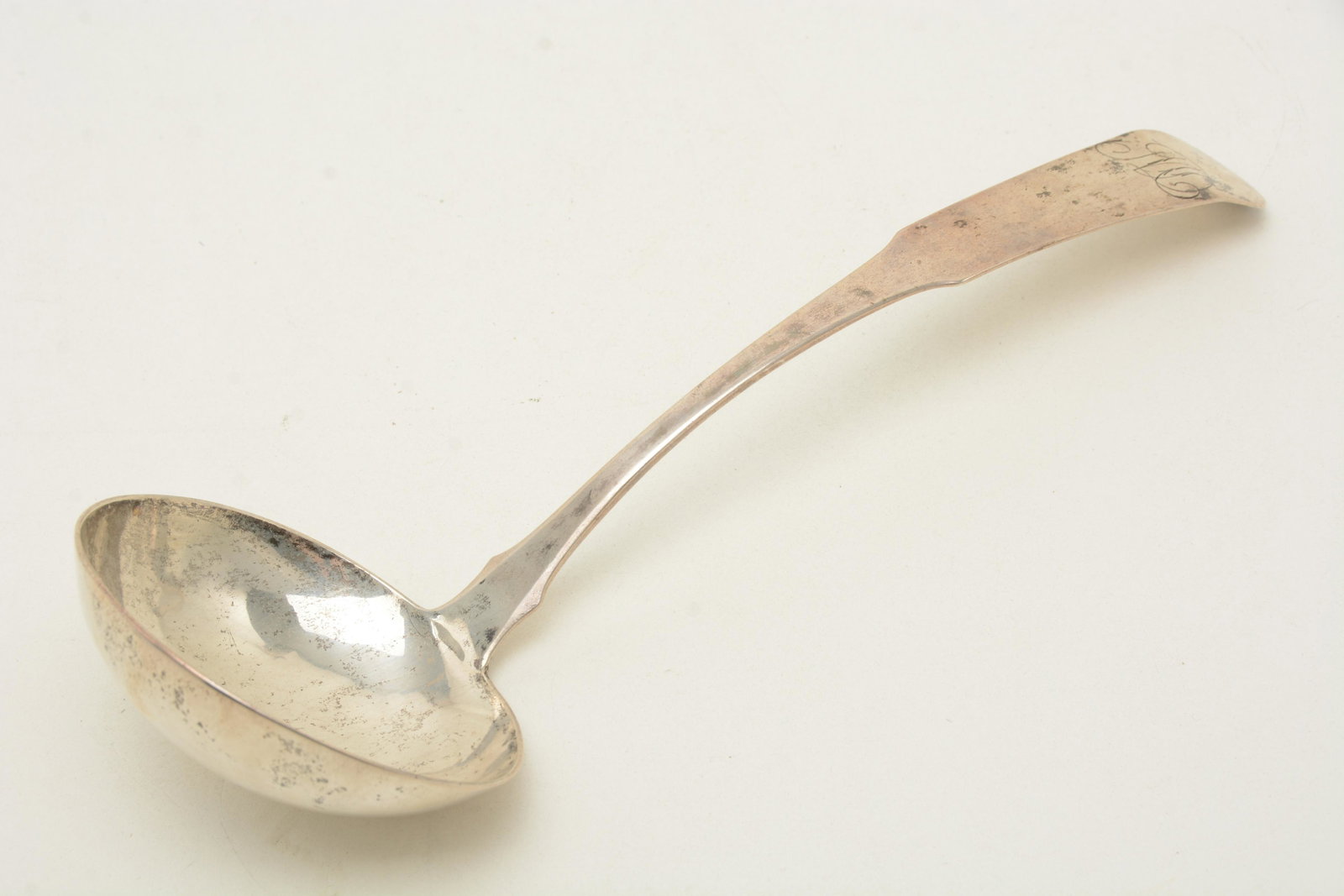 Kirk coin silver soup/punch ladle, Baltimore, with: Kirk coin silver soup/punch ladle, Baltimore, with assay marks. Fiddle, sharp fins, assay marks for 1824-27. Length 13-5/8". Bowl diameter 4-1/4". Weight 6-1/4 troy ounces. The monogram is a script MD