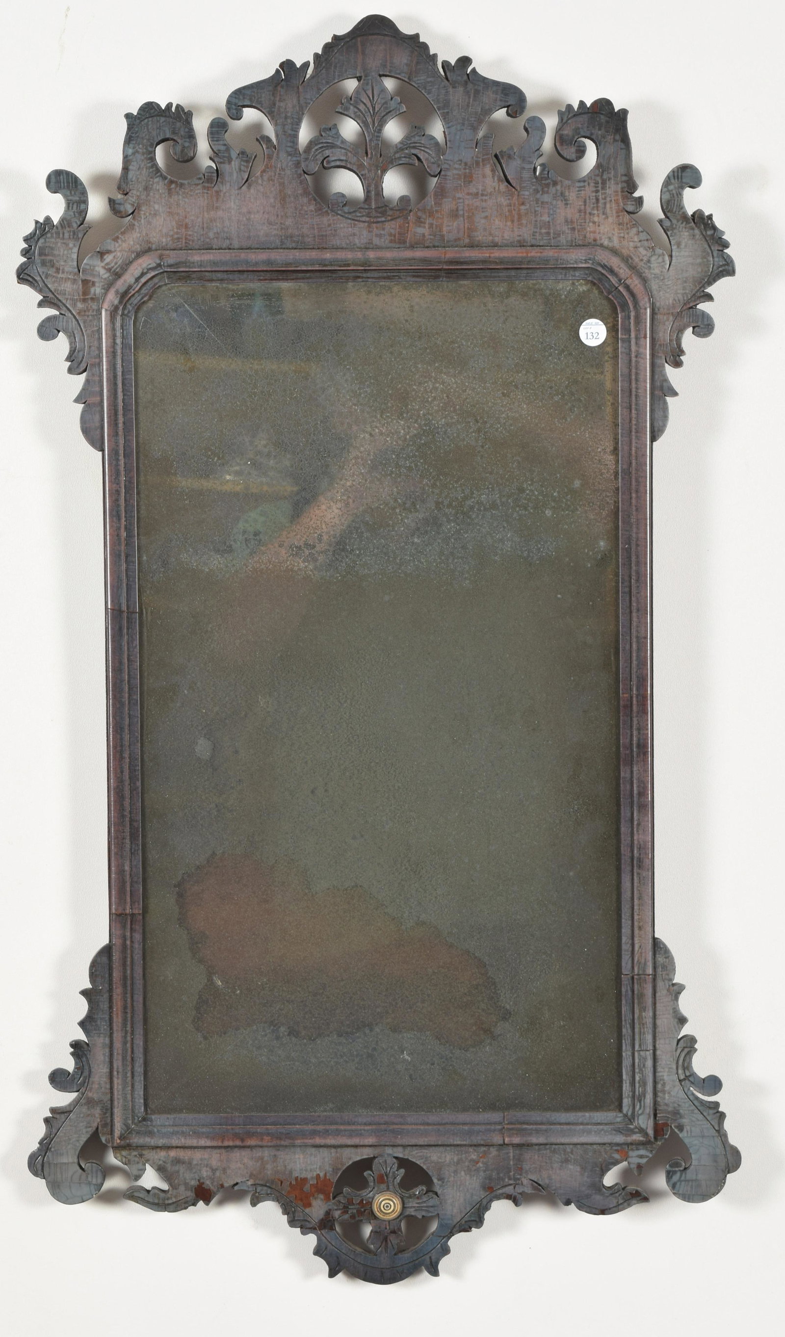 Fine Chippendale mahogany mirror with floral pierced: Fine Chippendale mahogany mirror with floral pierced caring and inlaid disk, attributed to James Stokes, Philadelphia circa 1790. 37 x 20” Old mirror glass with tarnish, surface with failed fini