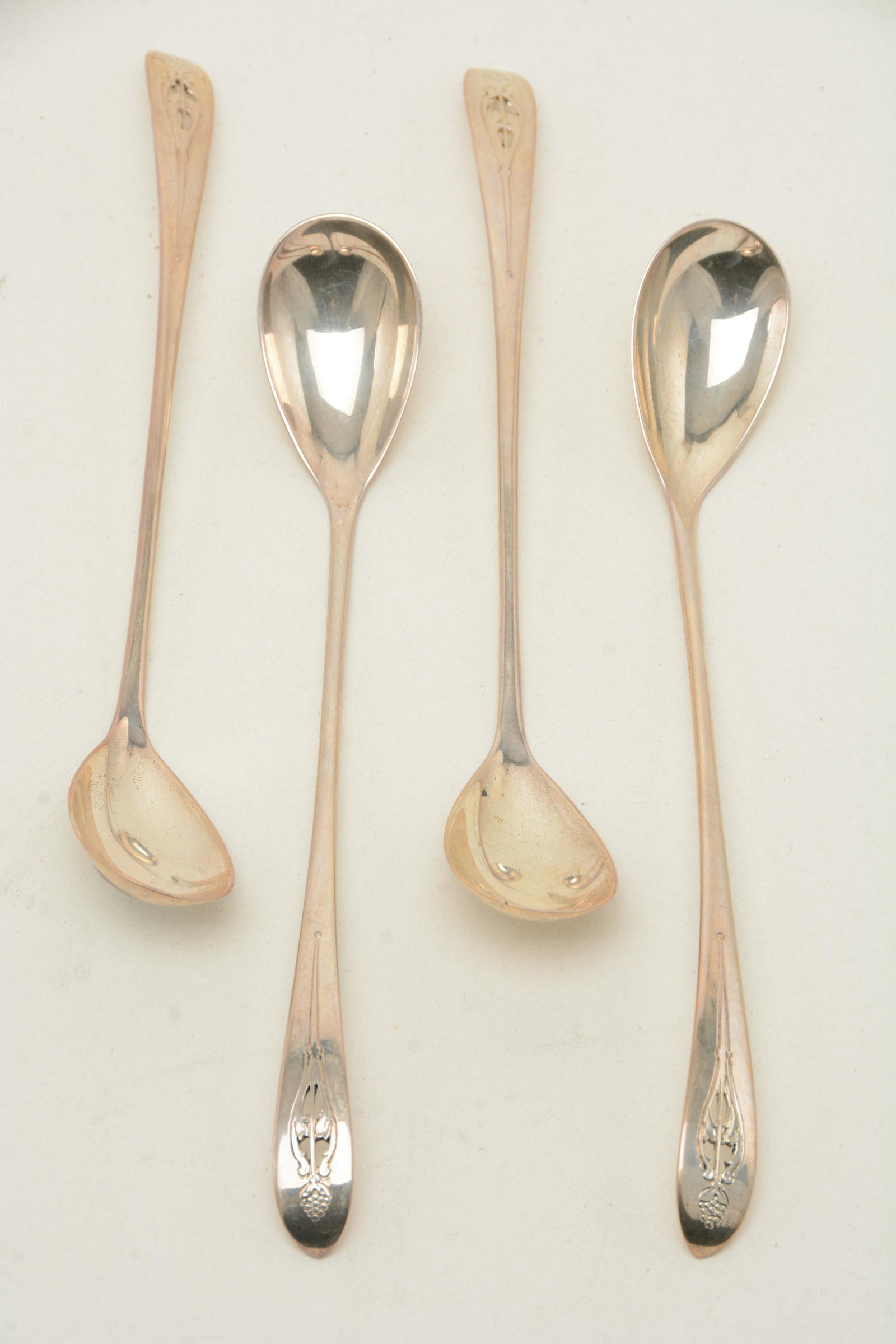 Arthur Stone sterling silver iced tea spoons, chased &: Arthur Stone sterling silver iced tea spoons, chased & pierced. Tipt, no drop. Length 7-7/8". Total weight 3.7 troy ounces (.925 oz. each). No monogram. From the David Thomas Collection and Gebelein s
