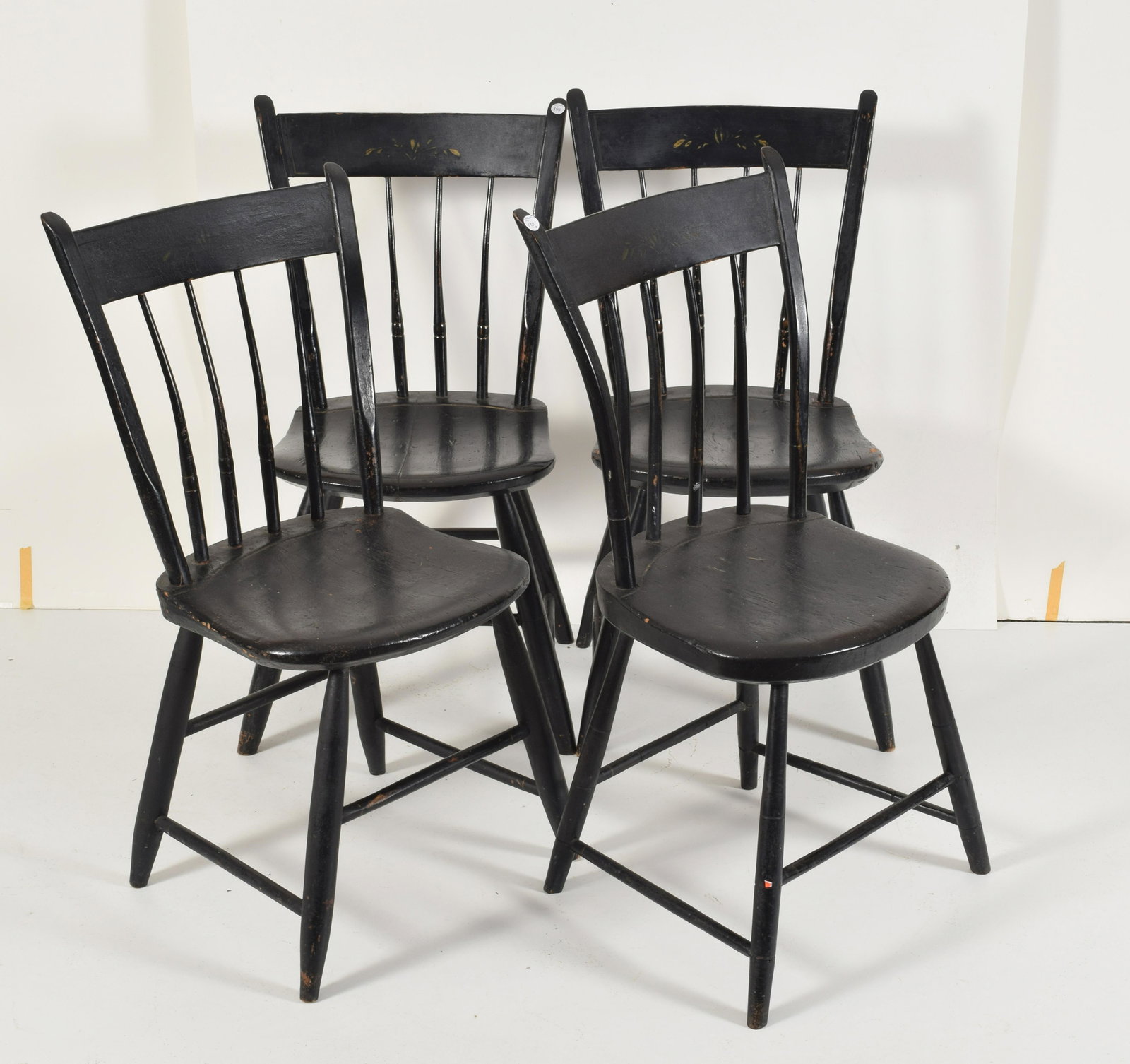Set of [4] black painted thumb back chairs with turned: Set of [4] black painted thumb back chairs with turned stiles and legs, 19th Century. 33” height. From the David Thomas Collection