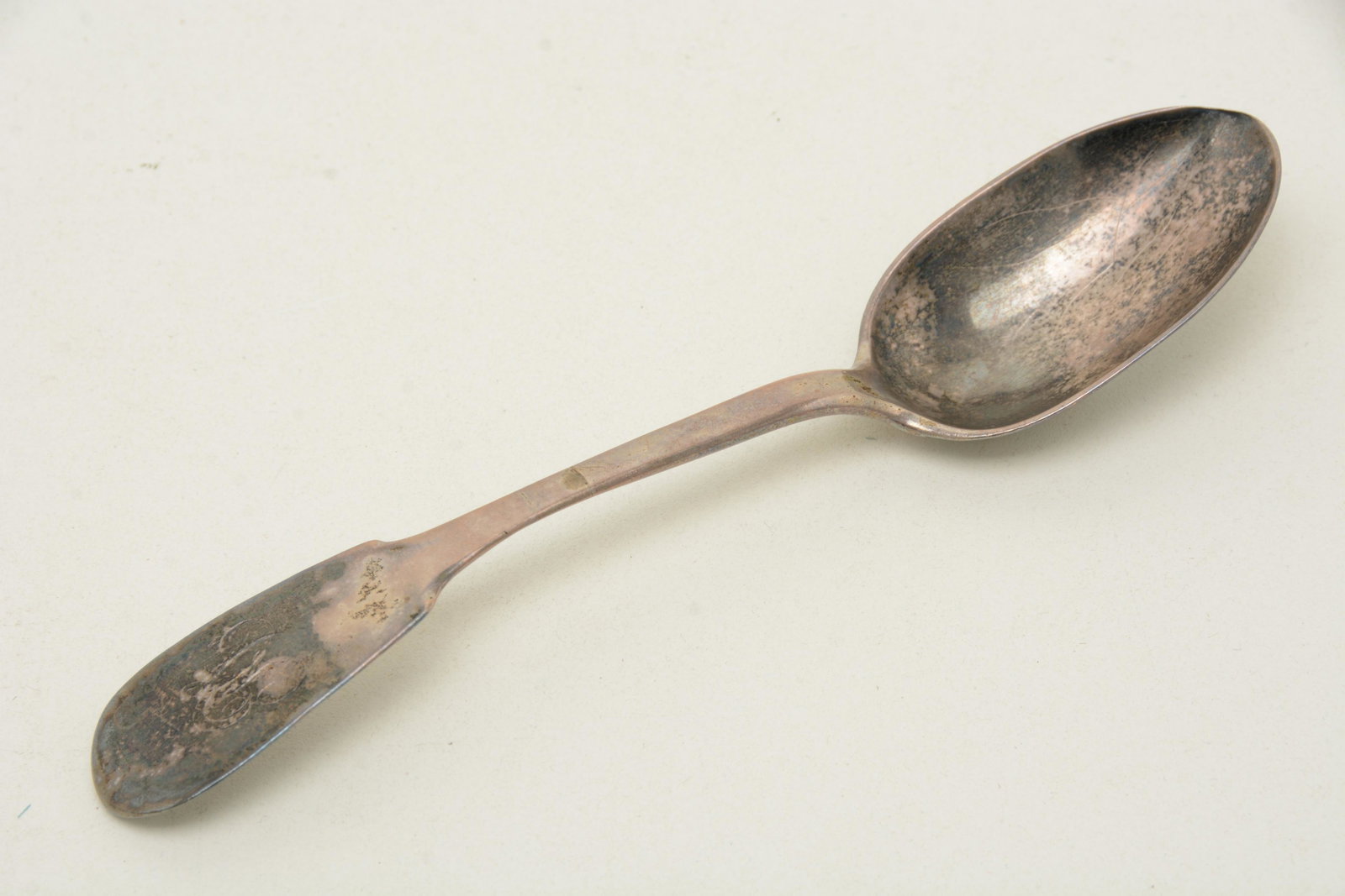 18th Century French-Canadian coin silver tablespoon.: 18th Century French-Canadian coin silver tablespoon. Monogram to fiddle handle. Wear to bowl. Appears to be marked ADP in stamp to backside. 2.18 ozt. 7.75” length. From the David Thomas Collect