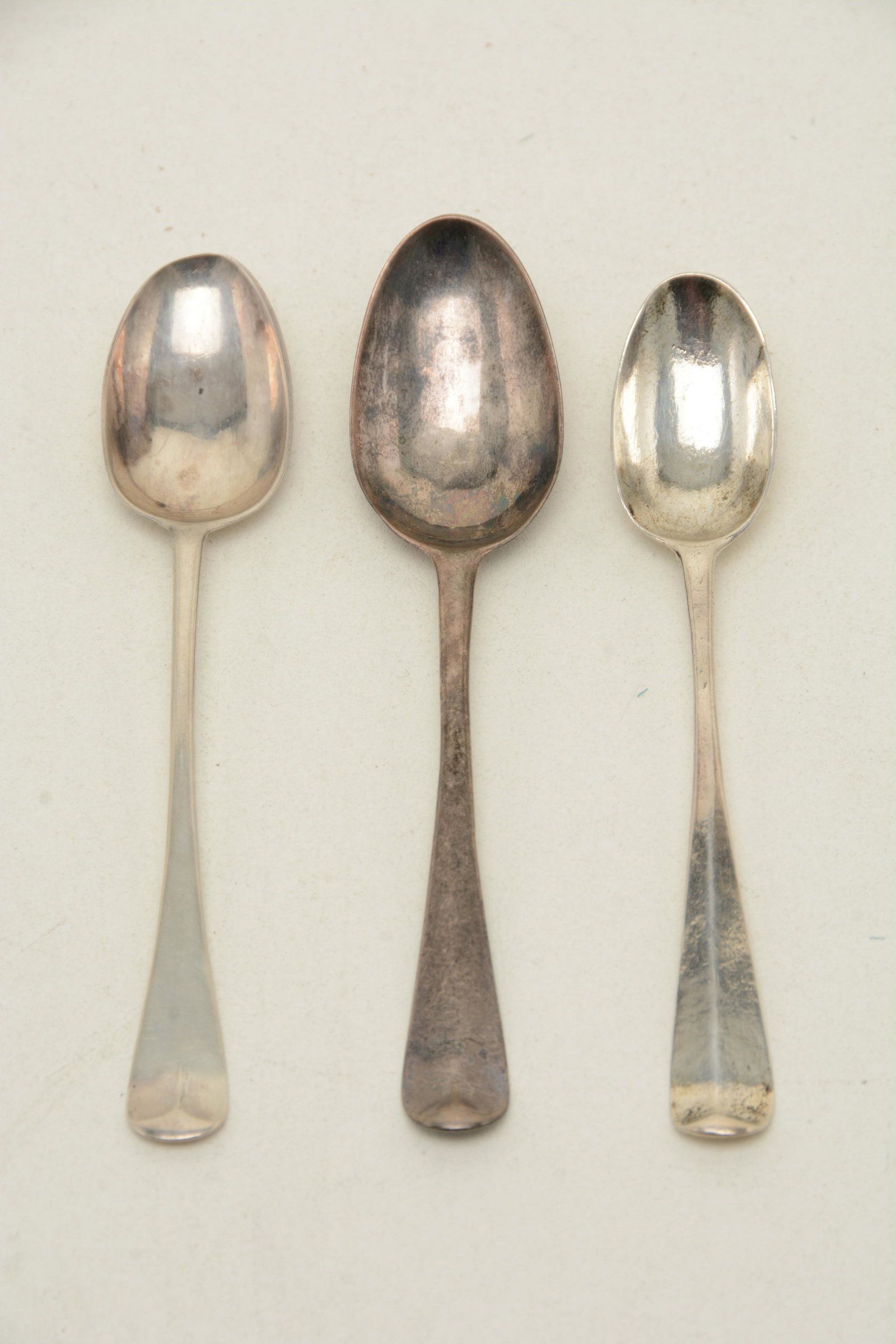 Colonial American and English silver teaspoons. Rattail: Colonial American and English silver teaspoons. Rattail teaspoon marked “IC”, ca. 1740s (0.26 ozt); teaspoon by Ebenezer Austin (Hartford, CT, 0.29 ozt); and a rattail teaspoon by Philip R