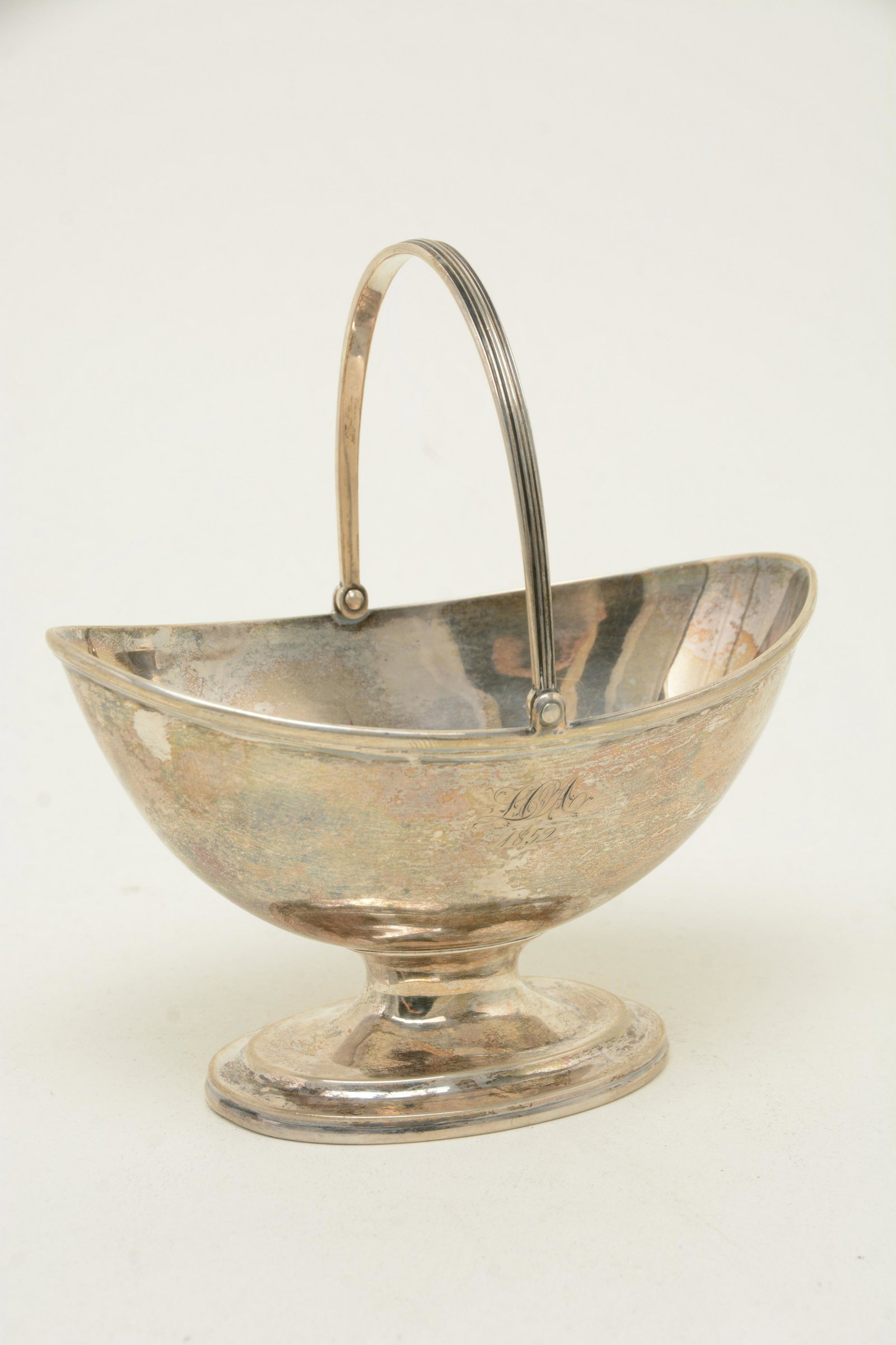 Eoff & Shepherd coin silver sugar basket. Swing handle,: Eoff & Shepherd coin silver sugar basket. Swing handle, boat shaped, molded applied elliptical foot. Marked N.YORK/E&S/BALL TOMPKINS&BLACK, the first two lines in rectangular cartouches, the third in 