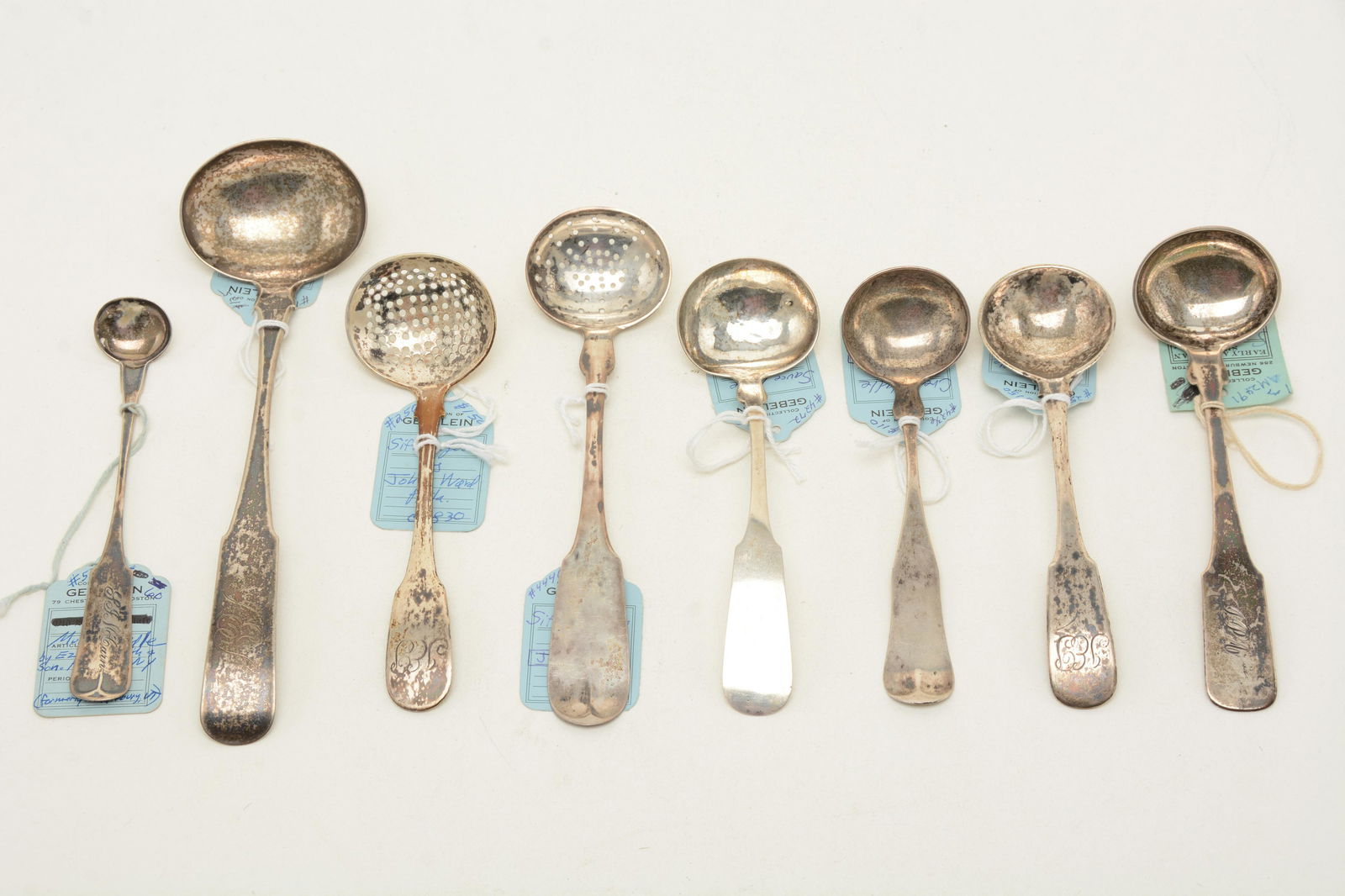 Lot of early 19th C. American coin silver ladles.: Lot of early 19th C. American coin silver ladles. Includes [8] total pieces. Sifter spoon marked J.W. & G., sauce ladle by Newell Harding, sifter spoon by John Ward (Philadelphia), cream ladle marked