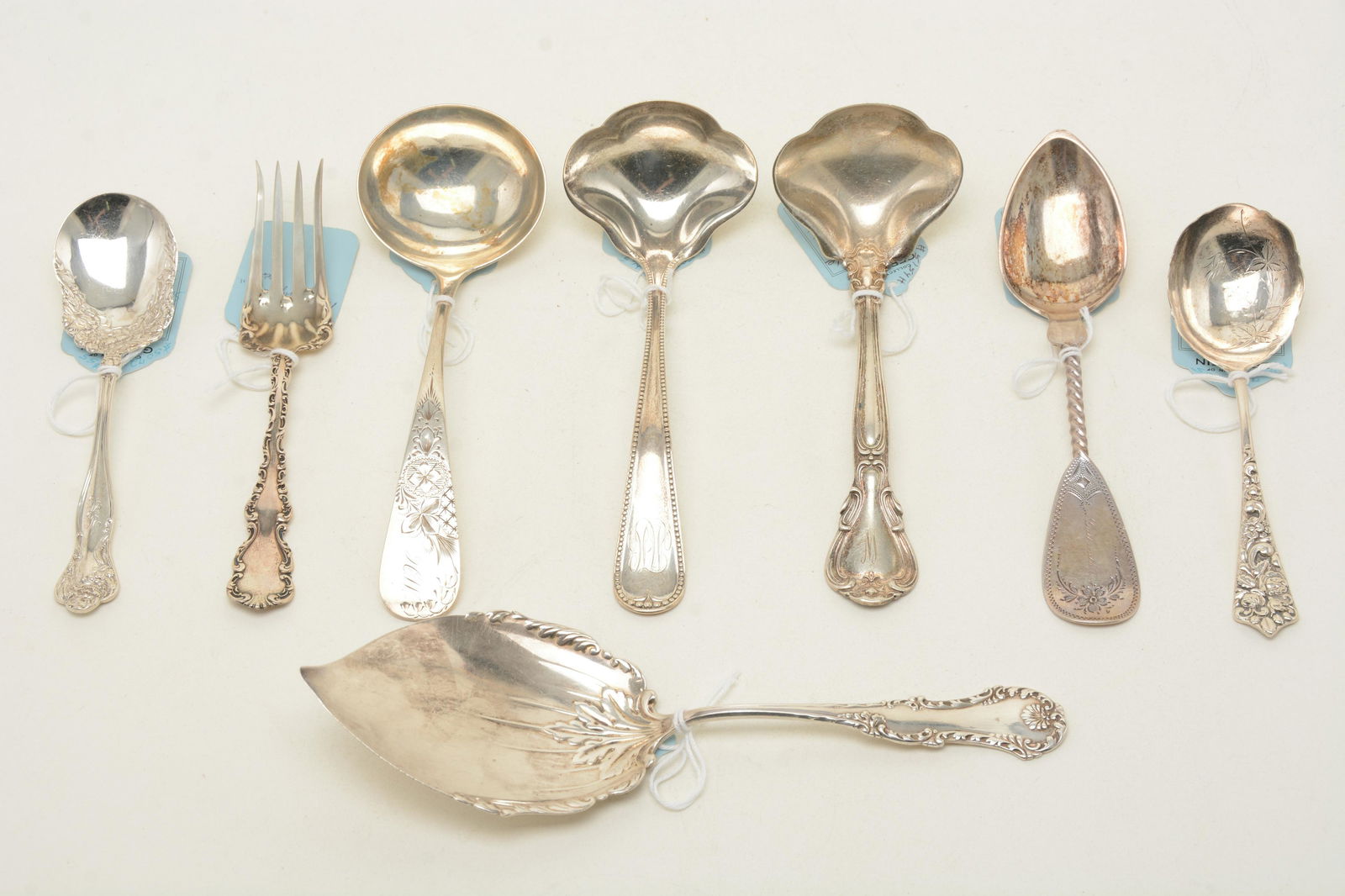 Victorian sterling silver serving utensils. Lot: Victorian sterling silver serving utensils. Lot includes [8] pieces with a pastry server by Frank Whiting, gravy ladle by Gorham, gravy ladle by Whiting Mfg., “Chantilly” gravy ladle by Go