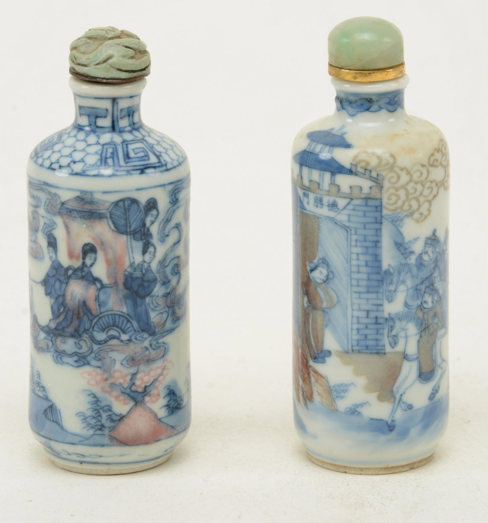 Two Underglaze Blue and Red Porcelain Snuff Bottles,: Two Underglaze Blue and Red Porcelain Snuff Bottles, China, 19th century, each of cylindrical shape and decorated with figures in a landscape and capped with jade and turquoise stoppers. Each with chi