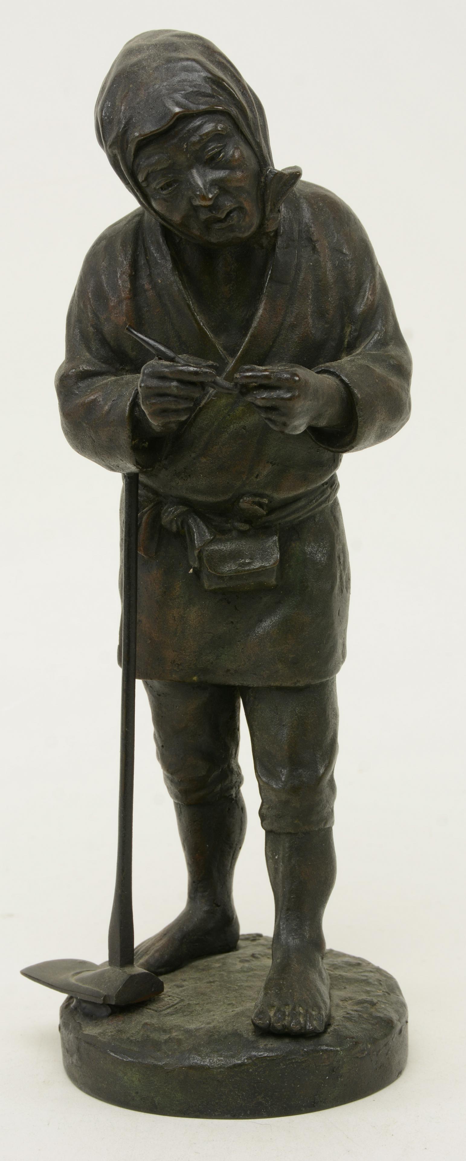 Bronze Figure of Standing Woodcutter, Japan, Meiji: Bronze Figure of Standing Woodcutter, Japan, Meiji Period, 19/20th century, leaning on his axe while filing his pipe. Height 12 in.