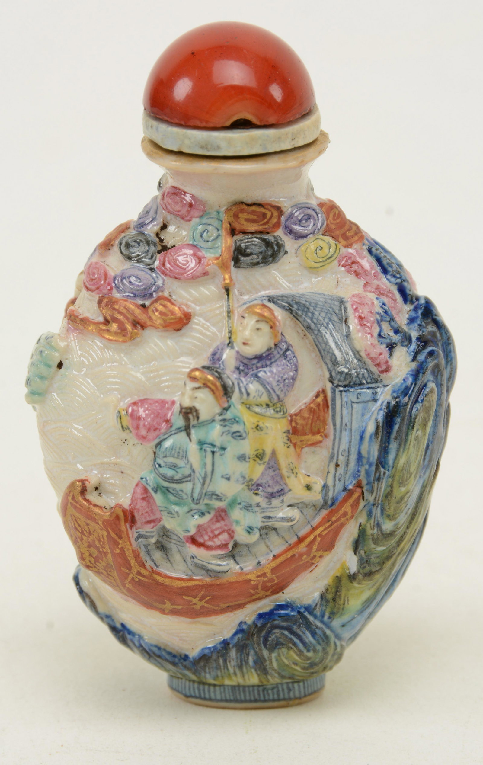 Carved Porcelain Snuff Bottle, China, Qing Dynasty,: Carved Porcelain Snuff Bottle, China, Qing Dynasty, 18th century, deeply carved ship-wreck of boat amidst waves and clouds. Carnelian stopper and four-character overglaze orange Qianlong mark and prob