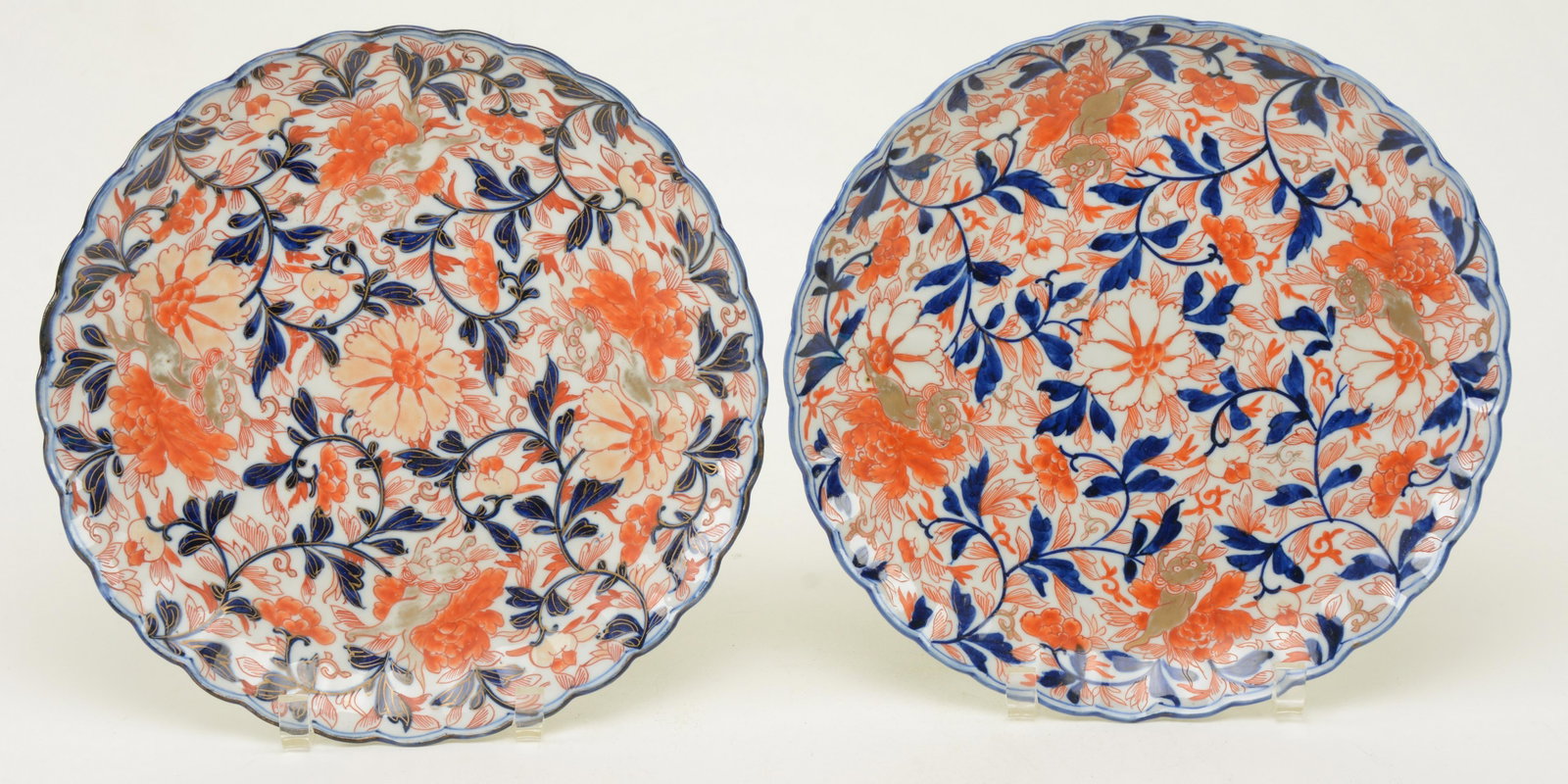 Pair of Imari Plates, Japan, Meiji Period, 19th: Pair of Imari Plates, Japan, Meiji Period, 19th century, decorated with gilt shishi among orange and blue scrolling foliage and flowers. Depth 11 in.