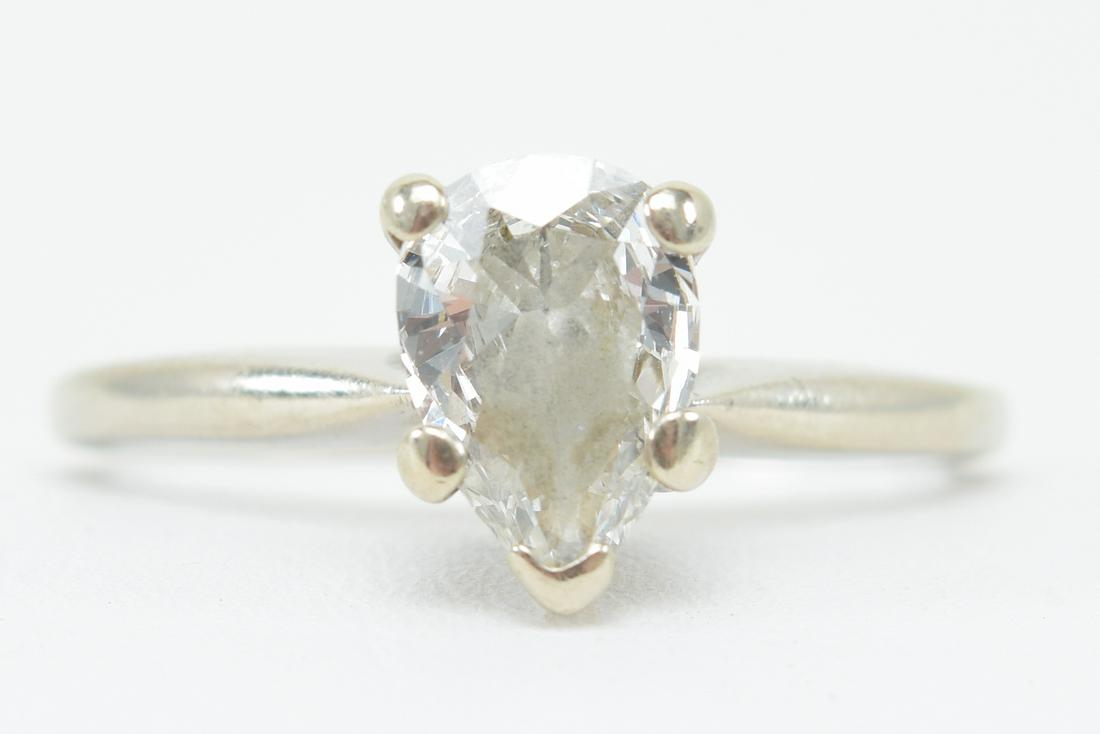 14 kt gold and pear shape diamond solitaire engagement: 14 kt gold and pear shape diamond solitaire engagement ring. Approximate size of stone 7 x 5mm. Ring marked 14 kt C.R.