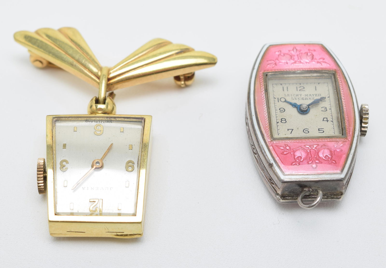 2 pendant watches, Leicht-Mayer watch with ovoid: 2 pendant watches, Leicht-Mayer watch with ovoid enameled case, height 1in, Juvenia watch suspended from V-shaped pin, case.75in x 5/8in.