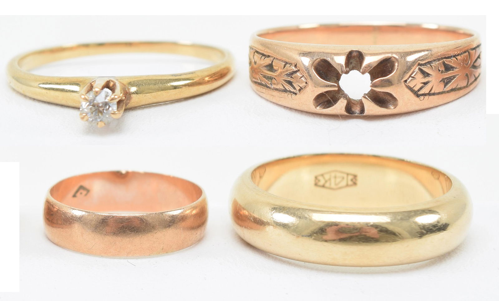 Lot of 4 gold rings. Includes: Wedding band marked: Lot of 4 gold rings. Includes: Wedding band marked 14kt. (2) Ring missing stone, unmarked (3) 14 kt marked ring with small diamond. (4) Tiny childâ€™s ring, hallmarked. 9.7 total grams.