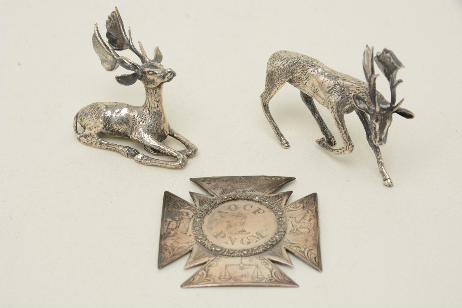 (3) English sterling silver Masonic pin: On (3) English sterling silver Masonic pin, 2.75in and two plated silver Elk, one reclining. Length, 3in