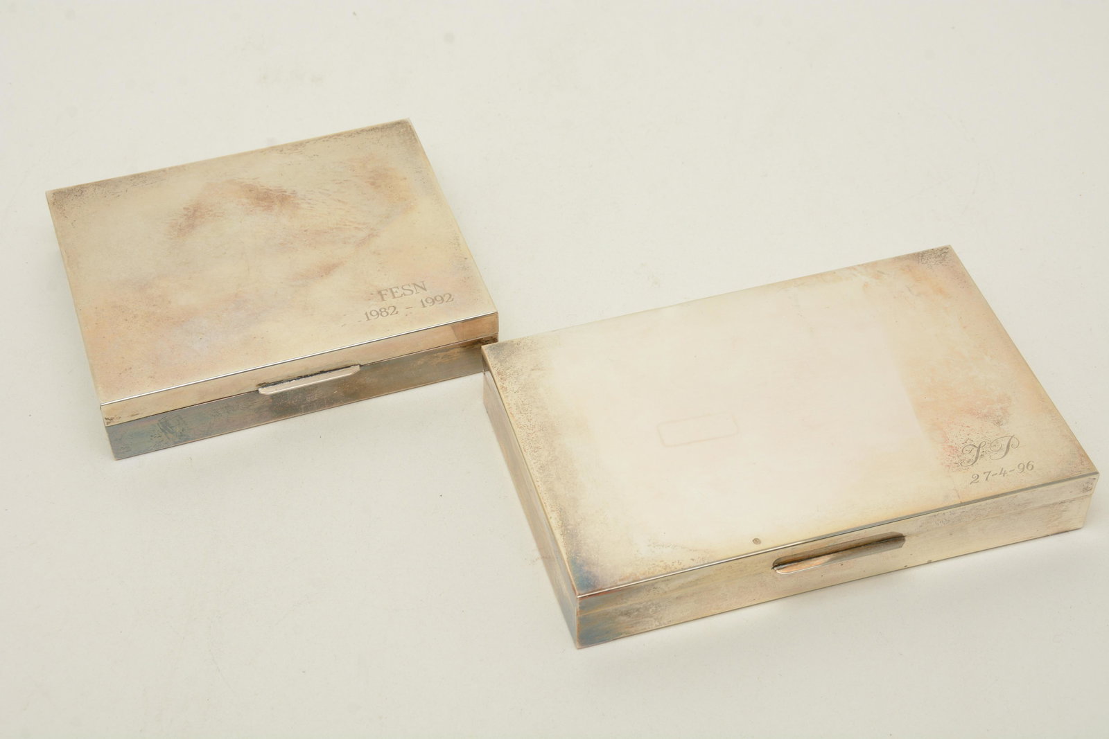 Two Italian silver and mahogany lined rectangular boxes: Two Italian silver and mahogany lined rectangular boxes, engraved on the corners, â€¦.1992 and 96â€™ stamped on the back rim, Dabbene 800 with the original label, Argenteria Dabbene. Milano 5