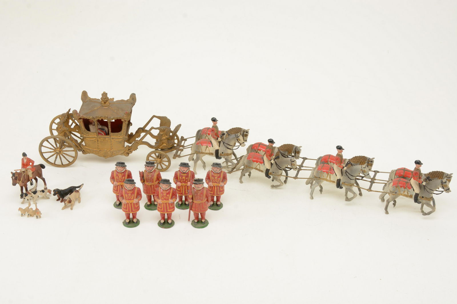 Britains stage coach miniature. Together with eleven: Britains stage coach miniature. Together with eleven unmarked beefeaters and fox hunter and hounds. Coach height 4in.