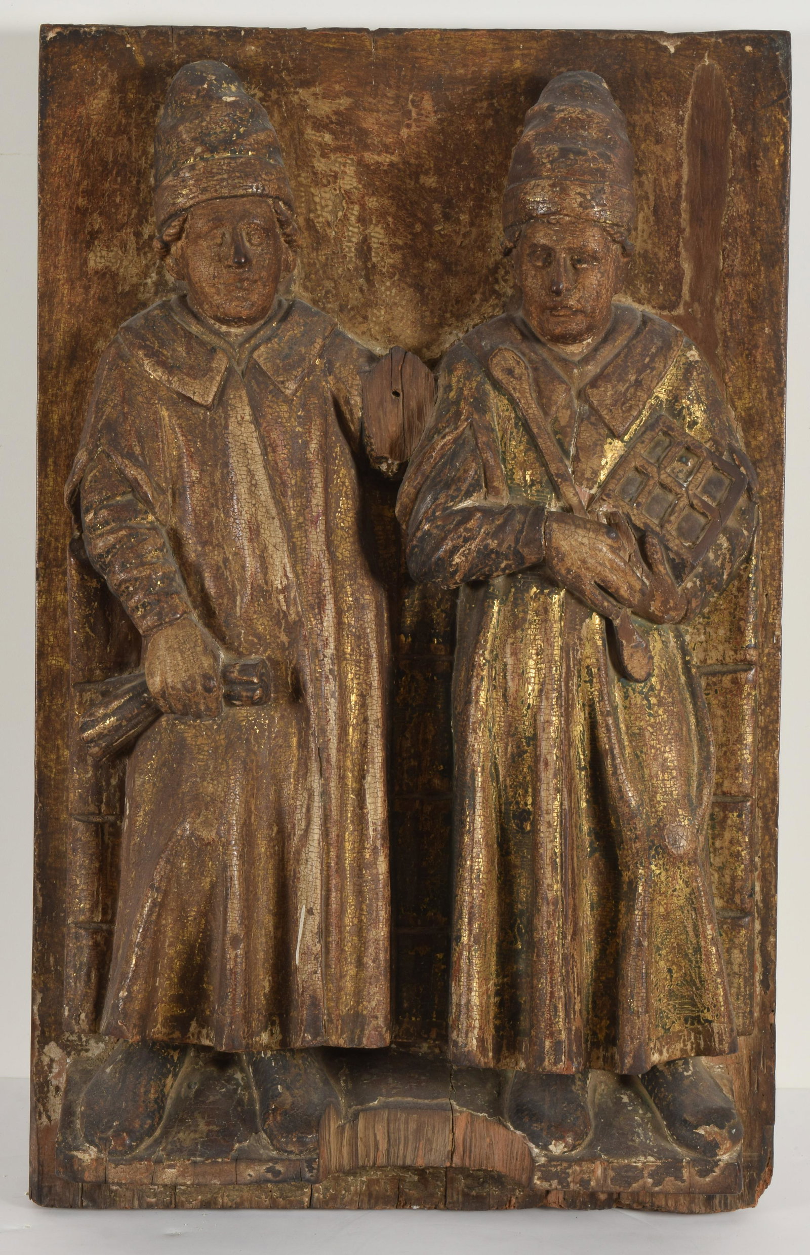 Antique Renaissance carved gilt wood panel of two: Antique Renaissance carved gilt wood panel of two bishops in robes. Carved from one piece of wood. Probably 16th/17th century. Remnants of old gilding. Height 29in, width 18in, depth 6in.