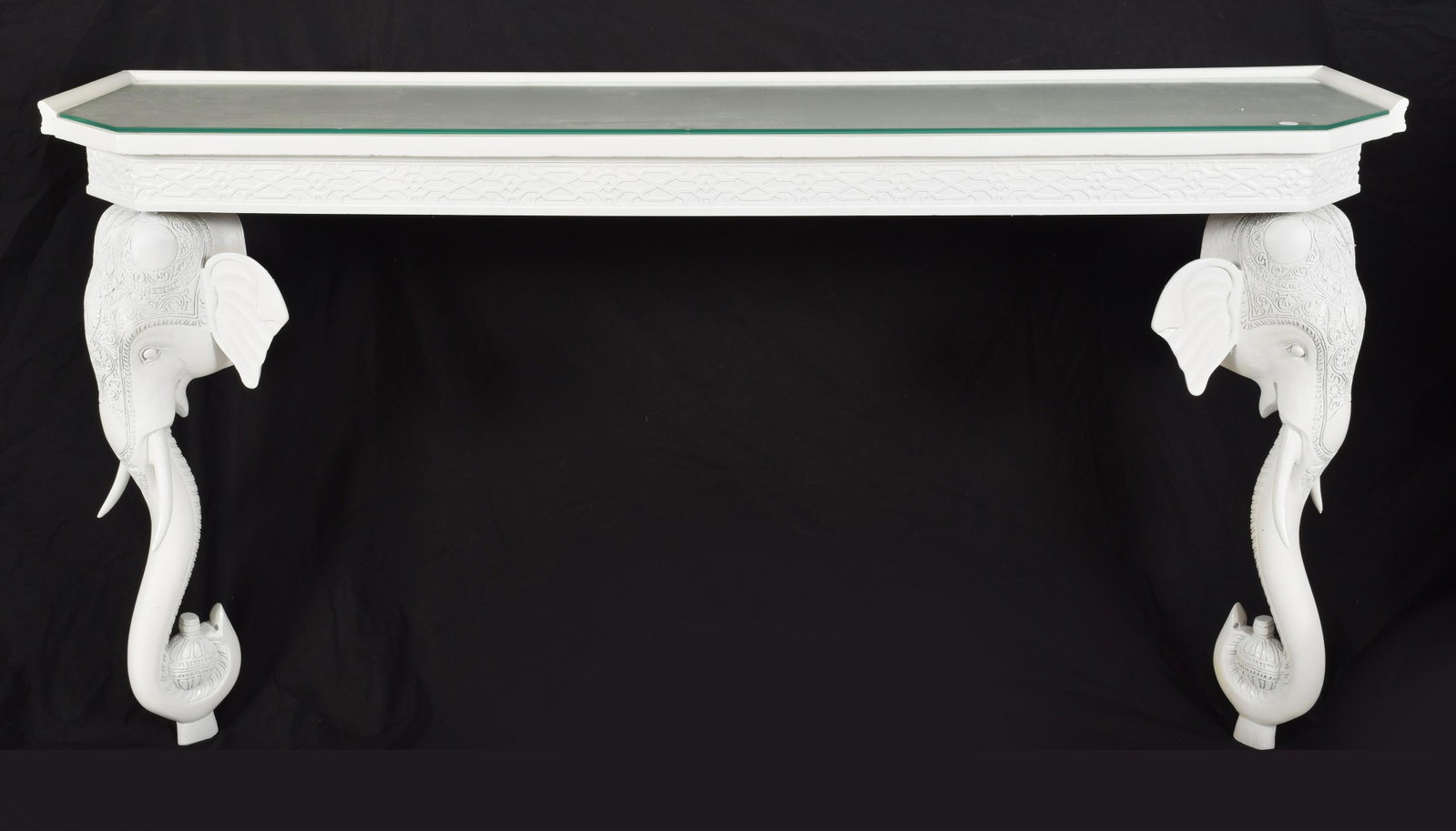 Gampel and Stoll Elephant console table, 1970s: Gampel and Stoll Elephant console table, 1970s. Figural elephant head legs with scrolled trunks. Glass top. 30.5 x 60.25 x 16 in. Good condition.