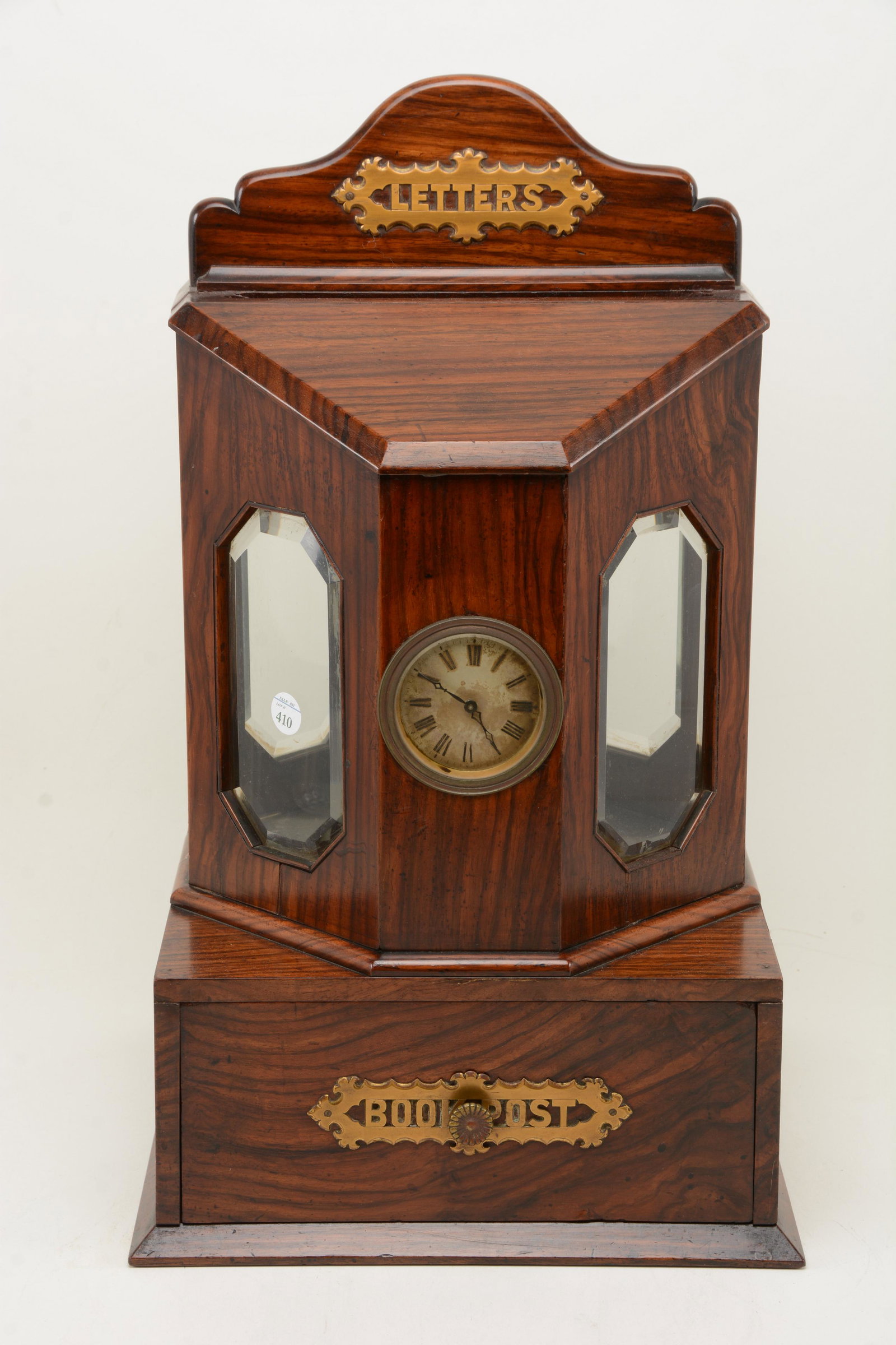 English Edwardian rosewood letter box with octagonal: English Edwardian rosewood letter box with octagonal top with four glass sides. One side with clock, base with drawer for â€œbook post” 20in x 11.75in x 11.5in.