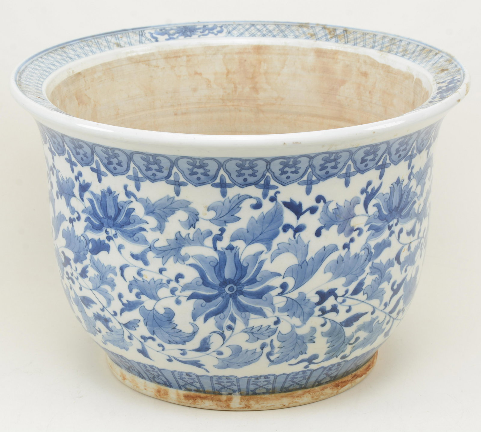 Chinese blue and white porcelain jardiniere. Minor: Chinese blue and white porcelain jardiniere. Minor staining. 16.5 in width.