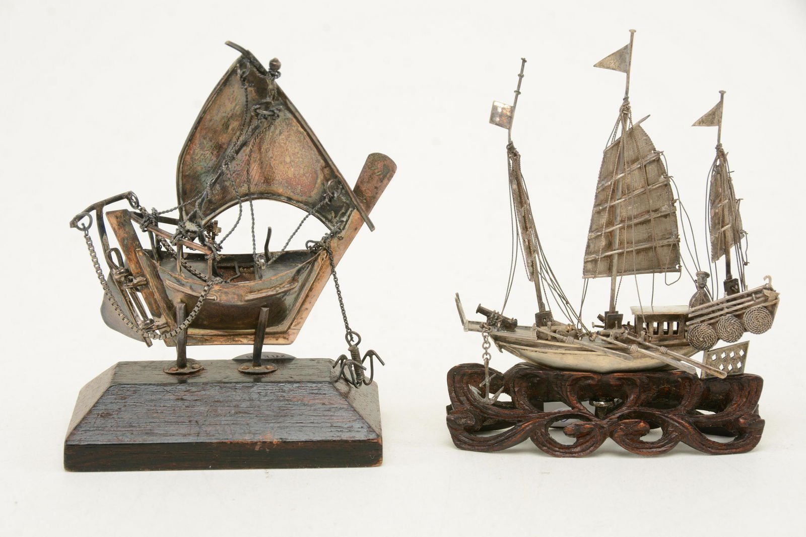 2 Chinese silver ships with stands. One depicts war (1 of 7)