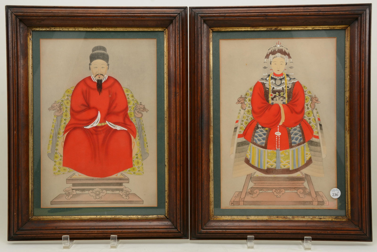 Pair of Chinese ancestral portraits. Gouache: Pair of Chinese ancestral portraits. Gouache embellishments on paper. Man and woman in red robes. 17.25 x 12.25 overall.