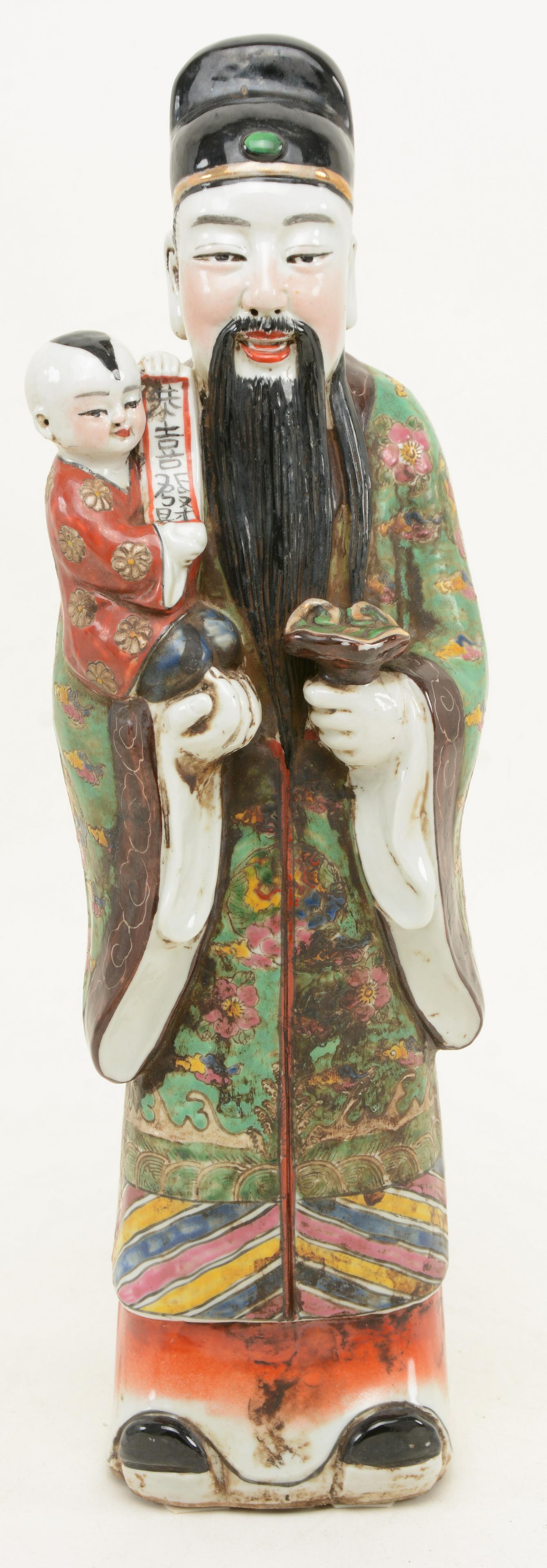 Chinese porcelain figure with child. Adorned in: Chinese porcelain figure with child. Adorned in turquoise ground robes with floral decorations. Dirtying to finish. 15 in height.