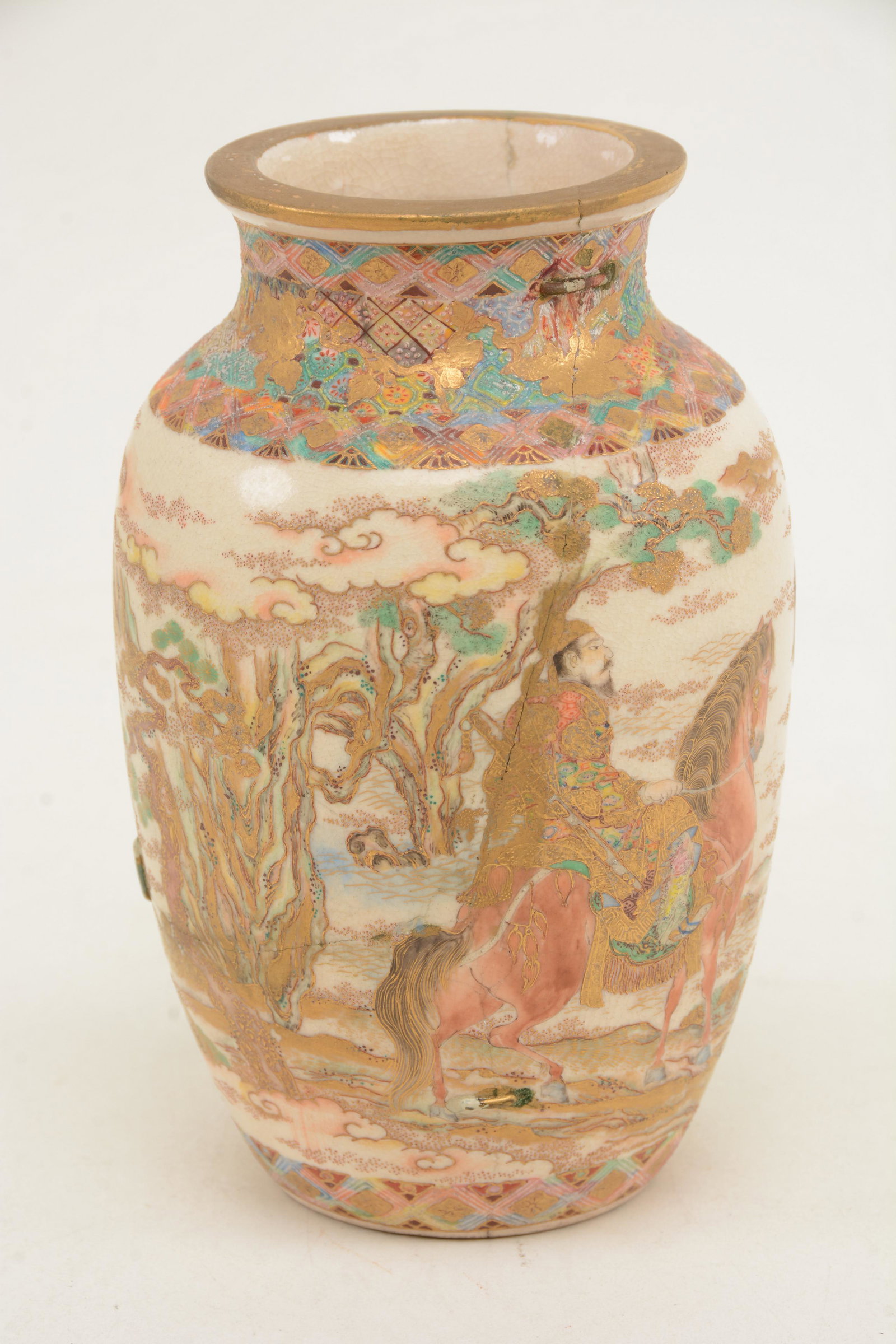 Japanese Satsuma vase. Figures on horseback in: Japanese Satsuma vase. Figures on horseback in mountainous landscape. Multiple staple repairs over hairlines. Marked to underside. 6.25 in height.
