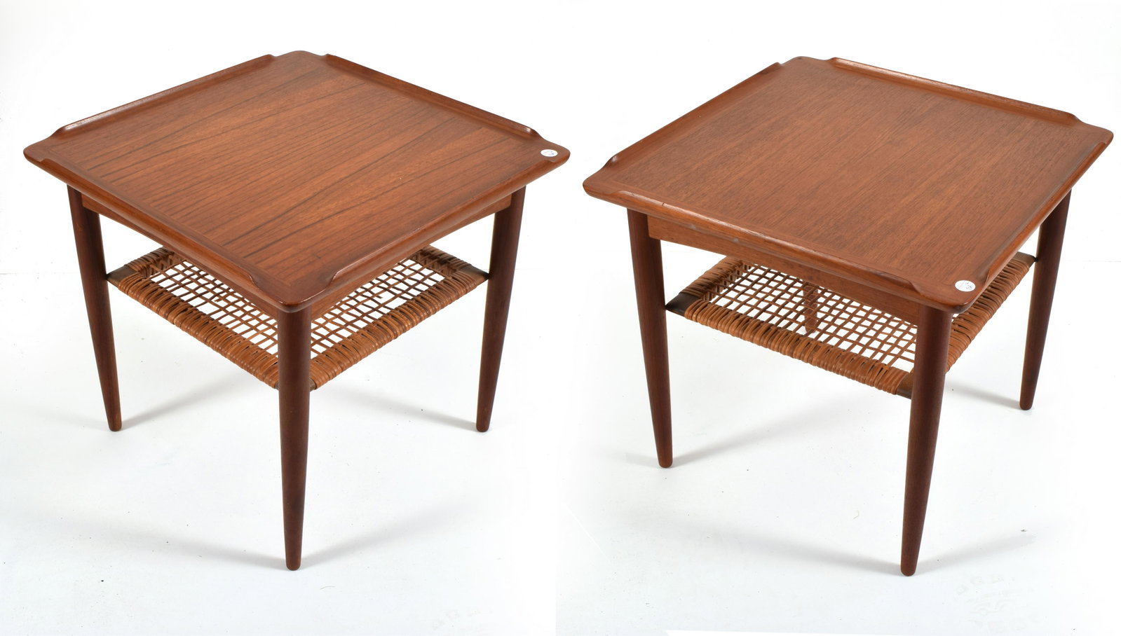 Poul Jensen for Selig Danish modern teak side tables,: Poul Jensen for Selig Danish modern teak side tables, pair. Turned, tapered legs supporting a square top with raised sides and open corners. Woven wicker shelf. Marked with enameled button tag to unde