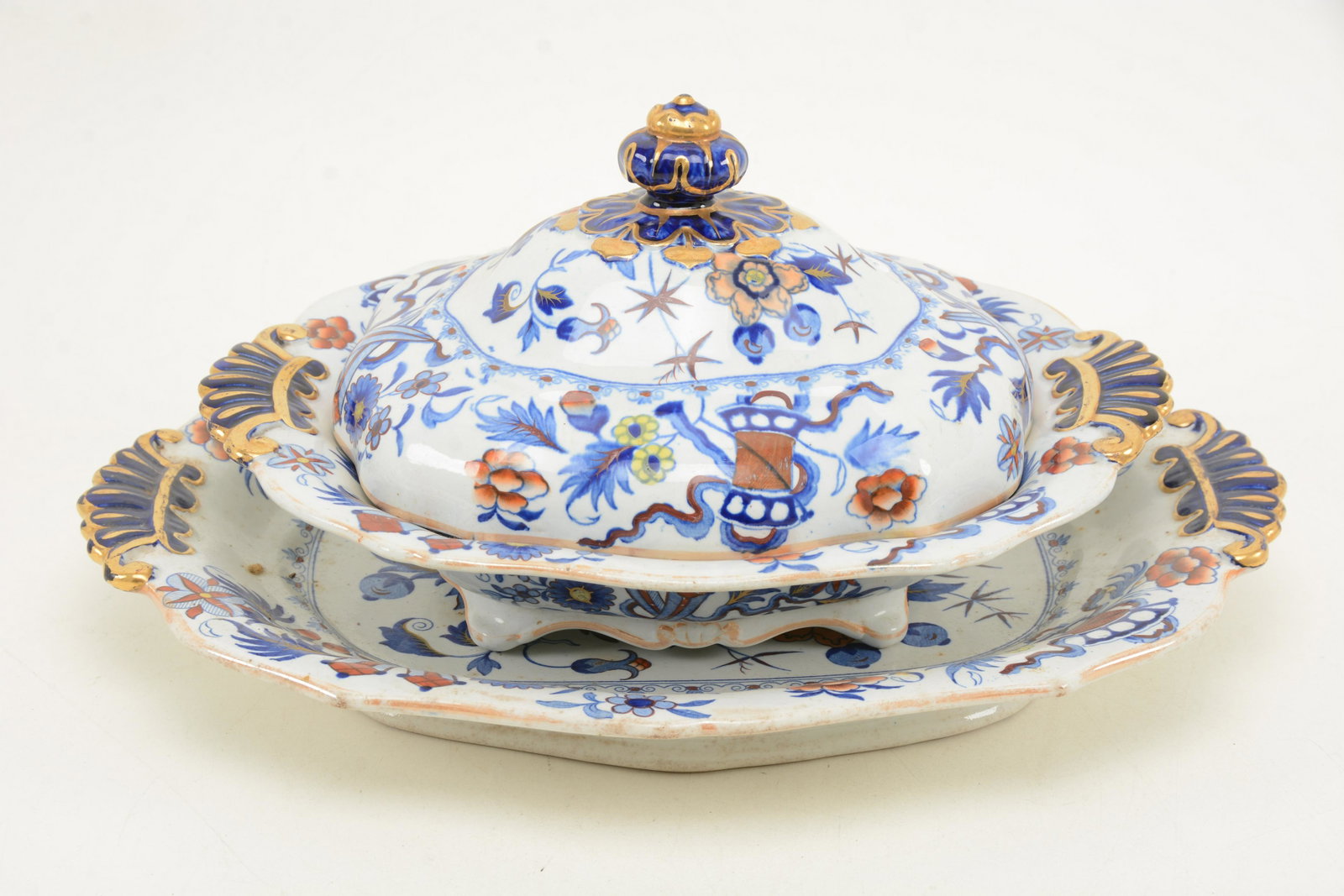 Mid-19th Century Ironstone covered vegetable and: Mid-19th Century Ironstone covered vegetable and undertray. All over floral decoration. Some loss to glazed edges. Height 7in, length 15 in