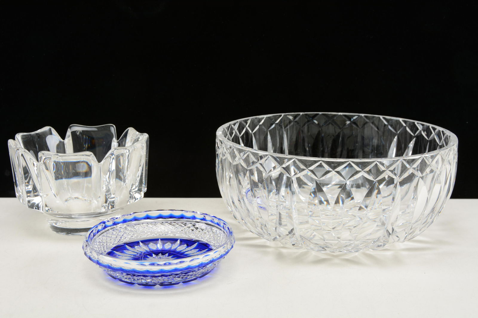 Crystal decorative dishes. Waterford 8in bowl together: Crystal decorative dishes. Waterford 8in bowl together with Orrefors hexagonal footed dish, and blue cut-to-clear candy dish. Good condition.