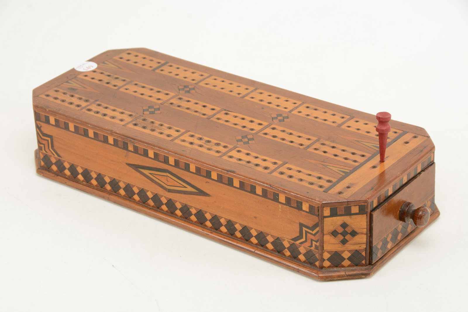 19th century cribbage board. Wood with marquetry inlay.: 19th century cribbage board. Wood with marquetry inlay. Light scratches and marks to wood throughout. 13.25"L x 5.5"W x 2.0"H.