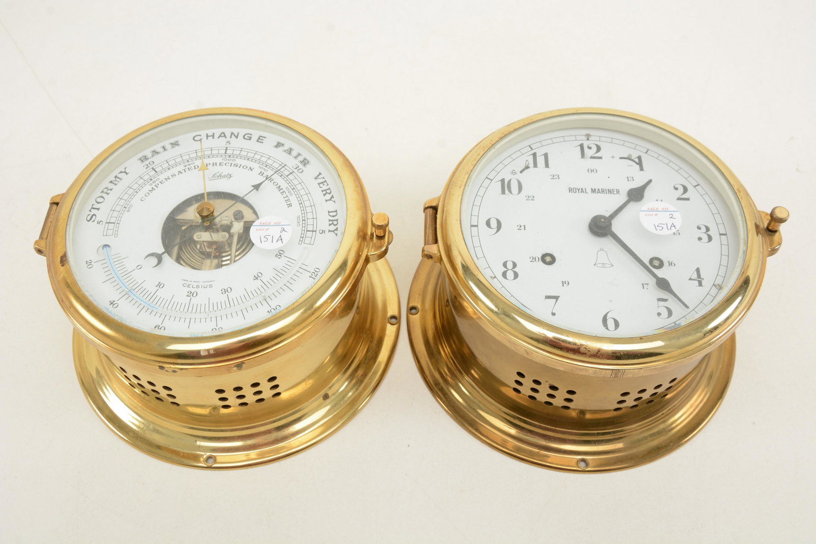 Royal Mariner brass ship's clock with Schatz brass: Royal Mariner brass ship's clock with Schatz brass case barometer and thermometer. Cases with minor spots of discoloration. 7in diameter each.