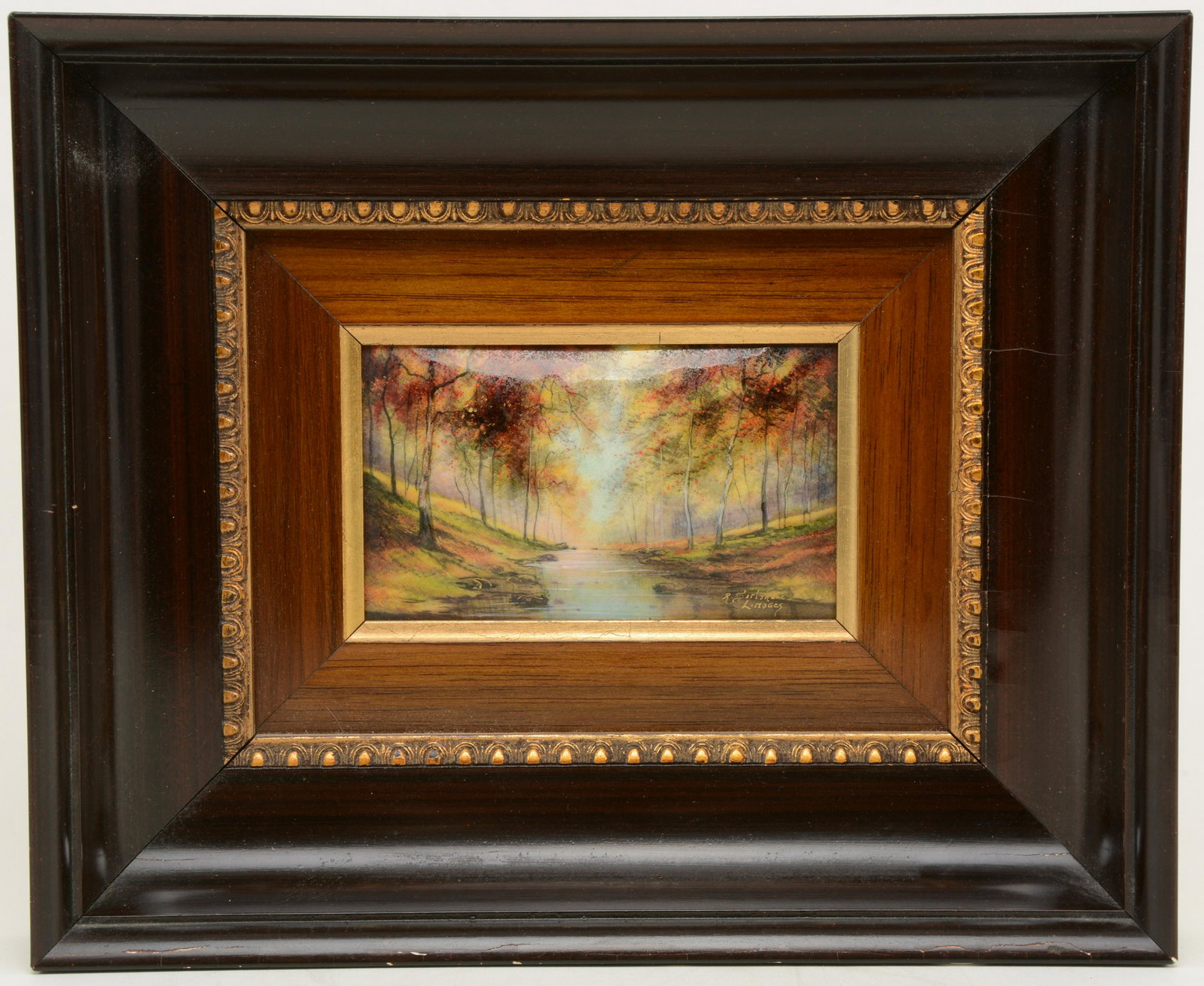 R. Sirlandie Limoges decorated enamel tile with: R. Sirlandie Limoges decorated enamel tile with autumnal landscape. Convex form. Signed lower right. Superficial damage to frame. Sight: 5.25 x 3in. Overall: 9.75 x 12in.