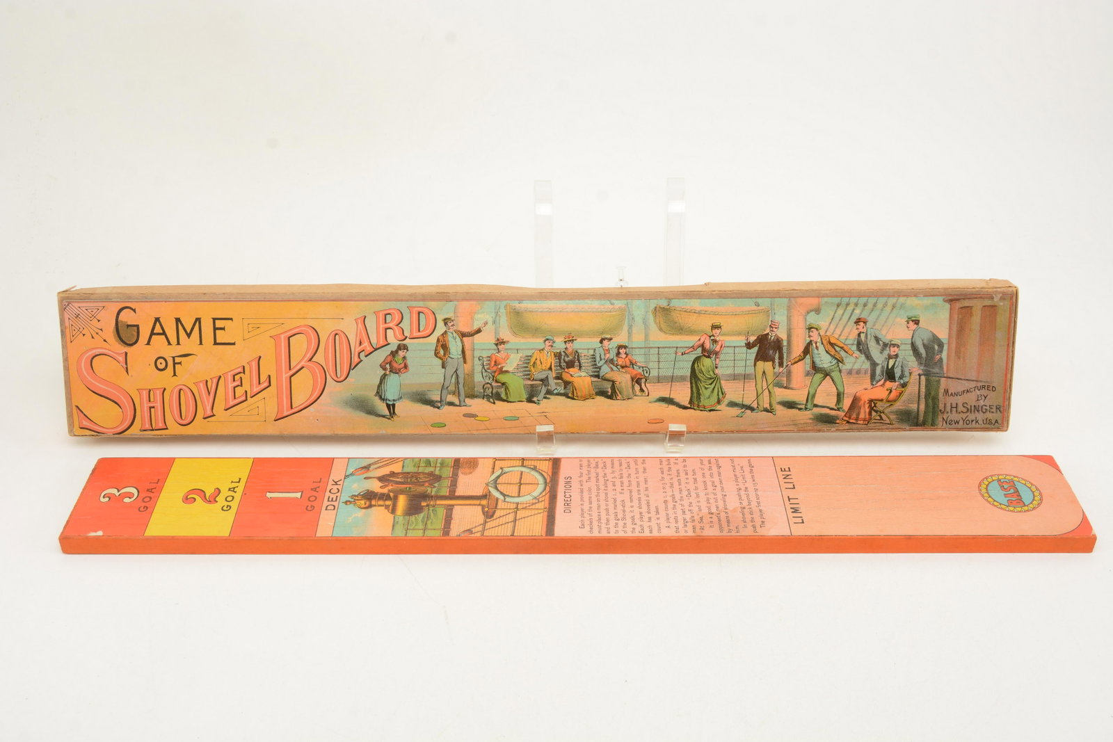 J.H. Singer game of shovel board. Complete with board,: J.H. Singer game of shovel board. Complete with board, mallet and balls. 24 in length.