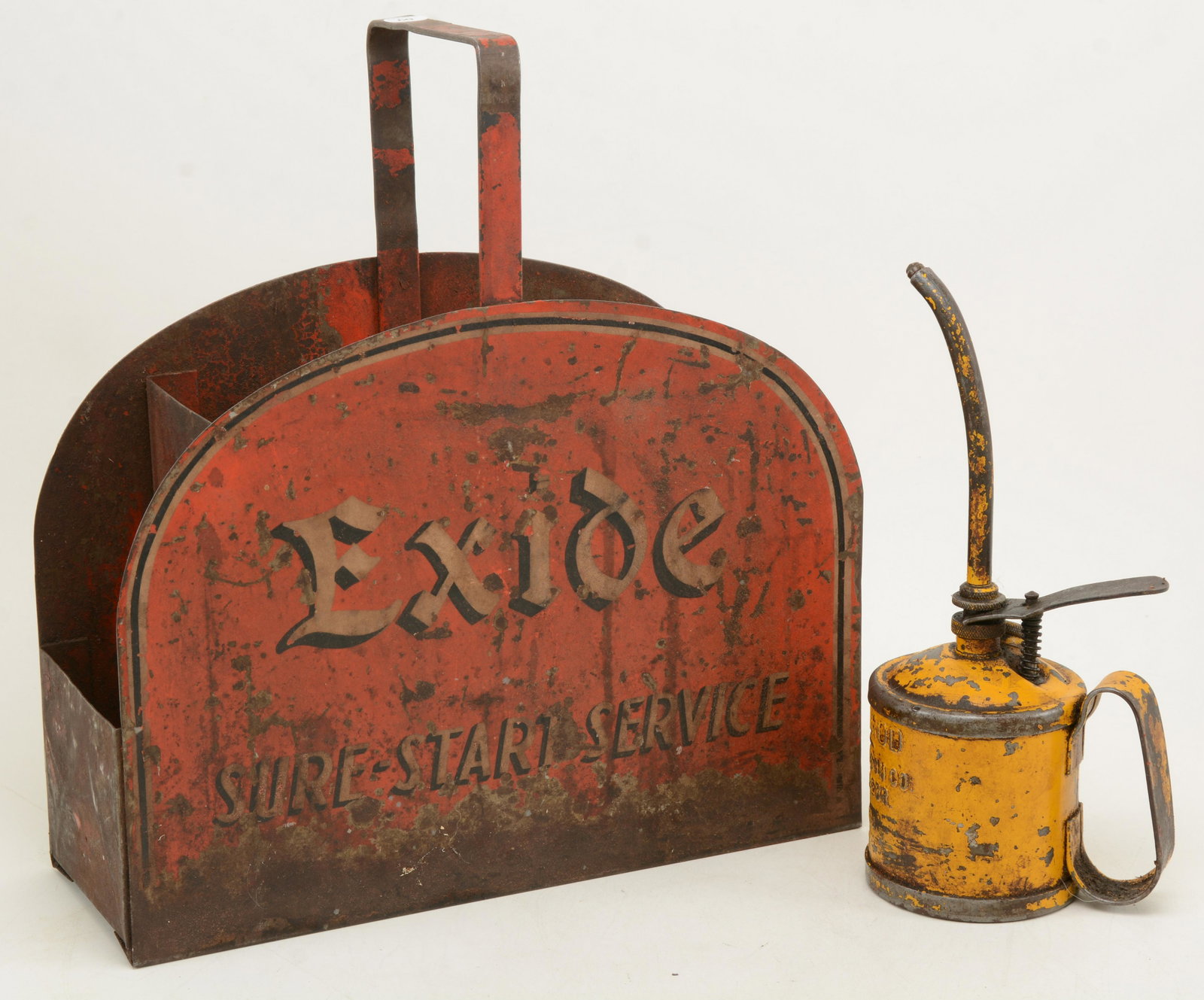 Exide Sure-Start gas station attendant metal service: Exide Sure-Start gas station attendant metal service carrier. One side shows wear and other is damaged. Together with goldenrod 1 pint painted steel squirt can with long neck. Height of latter 10 in.