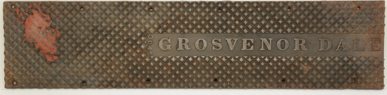 Cast iron Grosvenor Dale doorsill. Early 20th century.: Cast iron Grosvenor Dale doorsill. Early 20th century. Residue to one area. 32 in length.