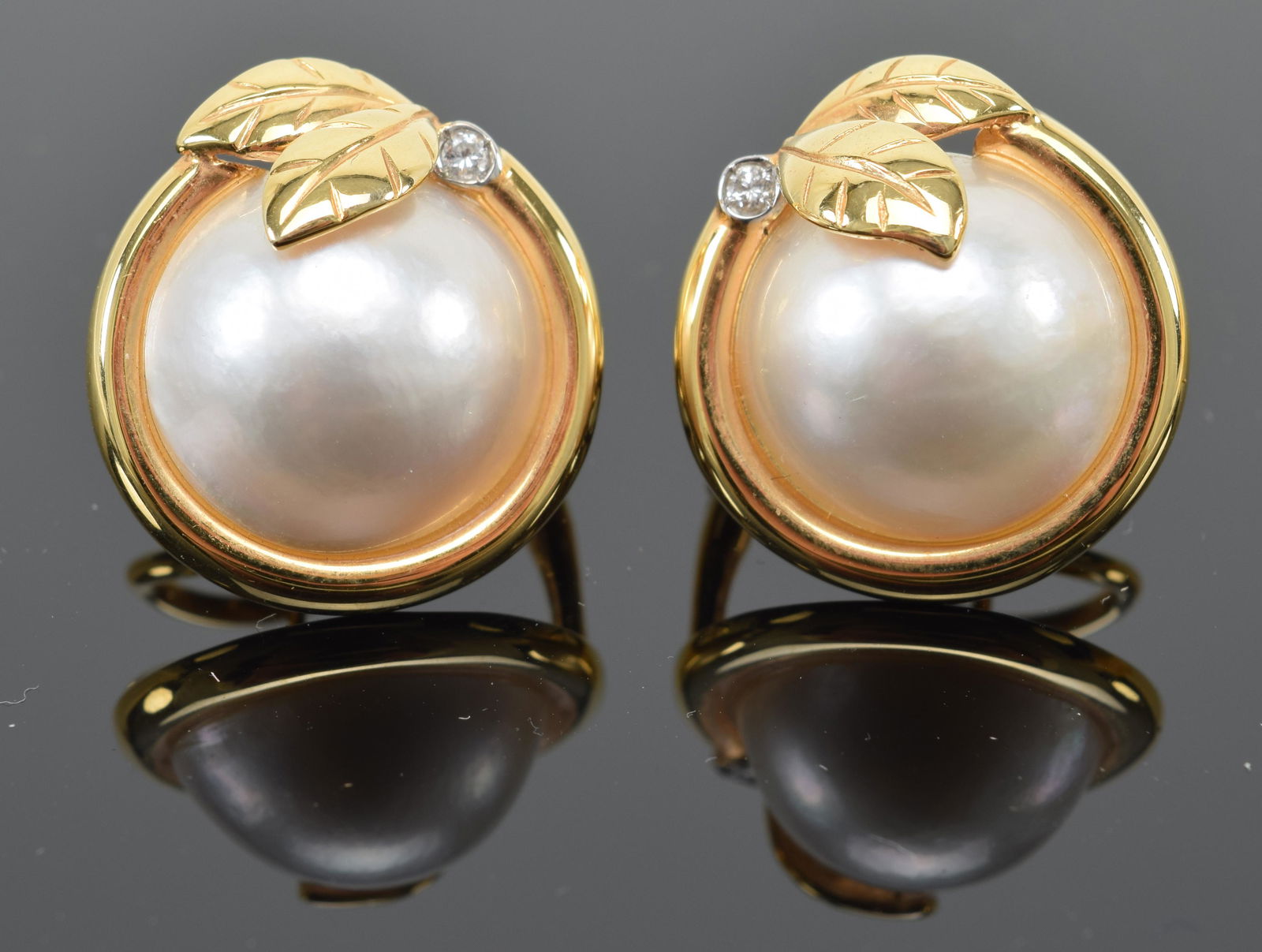 Pair of 14K gold and mabe pearl earrings. Pearls are (1 of 5)