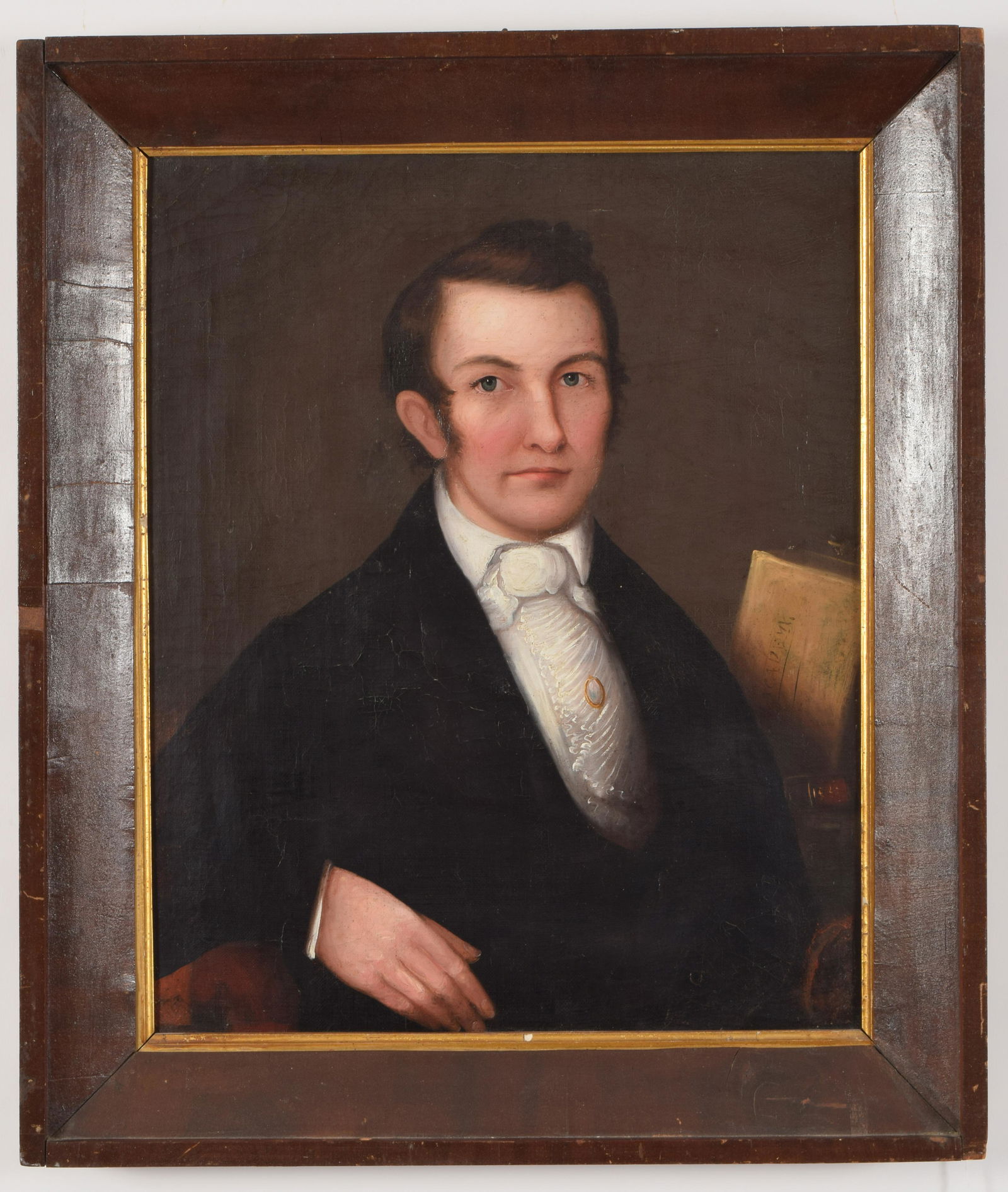 Early 19th century American school portrait of a man: Early 19th century American school portrait of a man seated with book and letter on table. Oil on canvas. Original mahogany veneered frame. Craquelure. Slight lifting. Scattered inpaint around figure