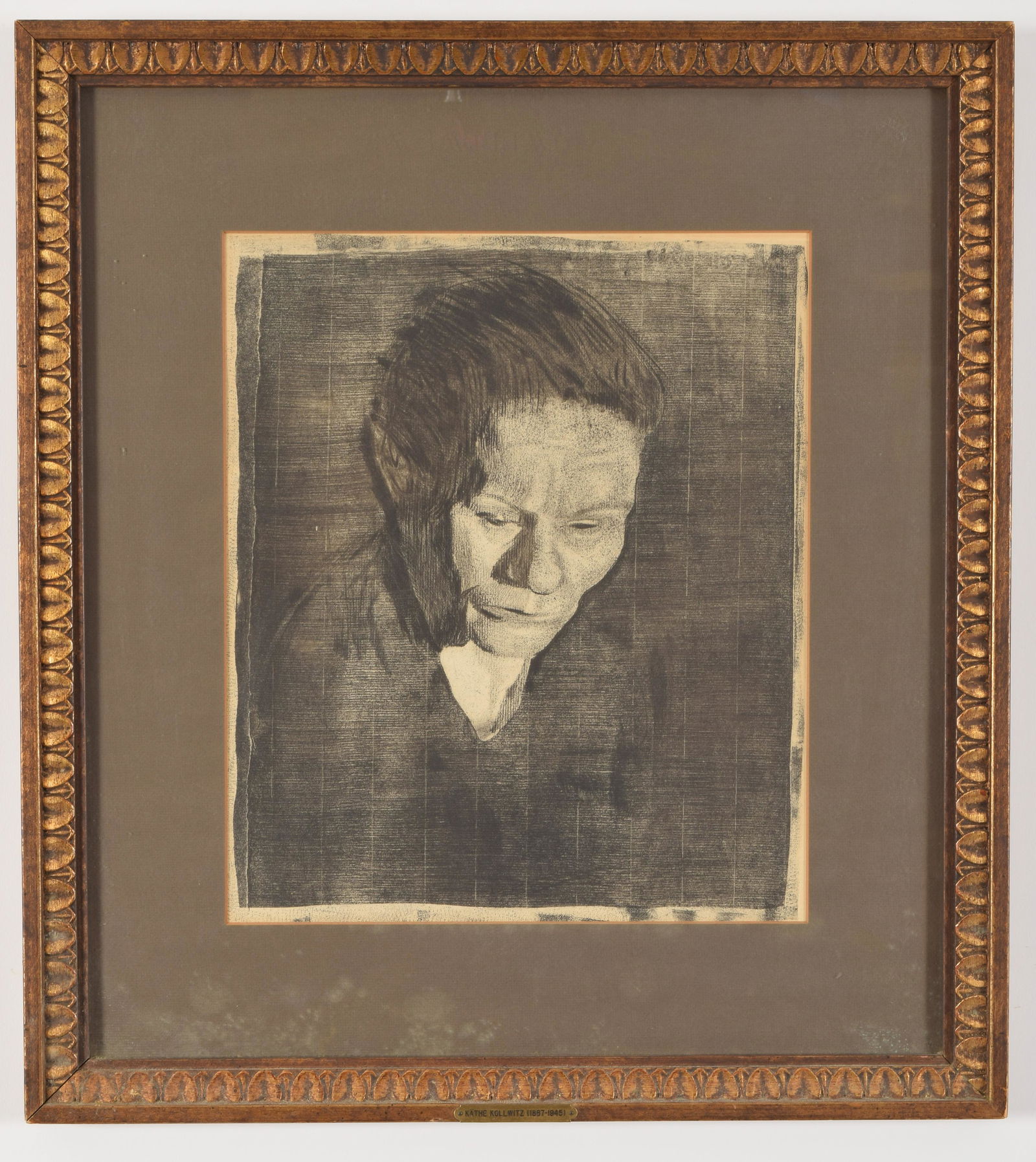 Kathe Kollwitz. German. "Bowed head woman". Framed.: Kathe Kollwitz. German. "Bowed head woman". Framed. Label on reverse. Sight: 14 x 12in. Overall: 22.5 x 20in.