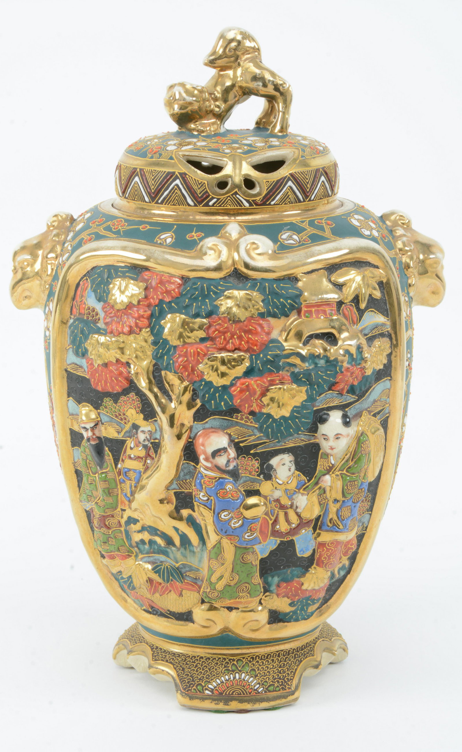 Satsuma parfumiere. Japan. Ca. 1930. Stoneware.: Satsuma parfumiere. Japan. Ca. 1930. Stoneware. Relief decoration of buddhist saints on green prunus flower ground. 13.75in high.