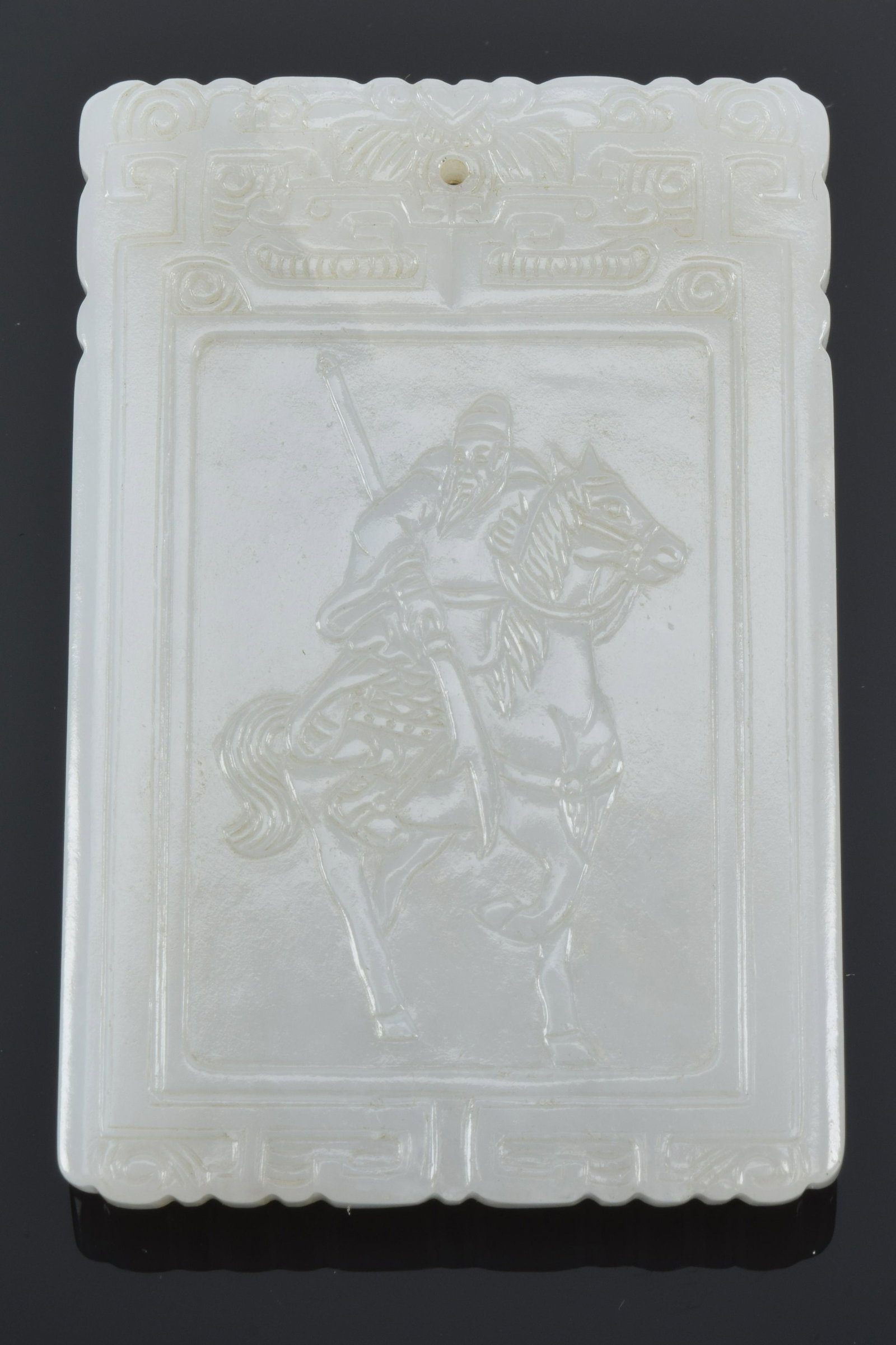 Jade pendant. Rectangular form. Surface carved with (1 of 8)