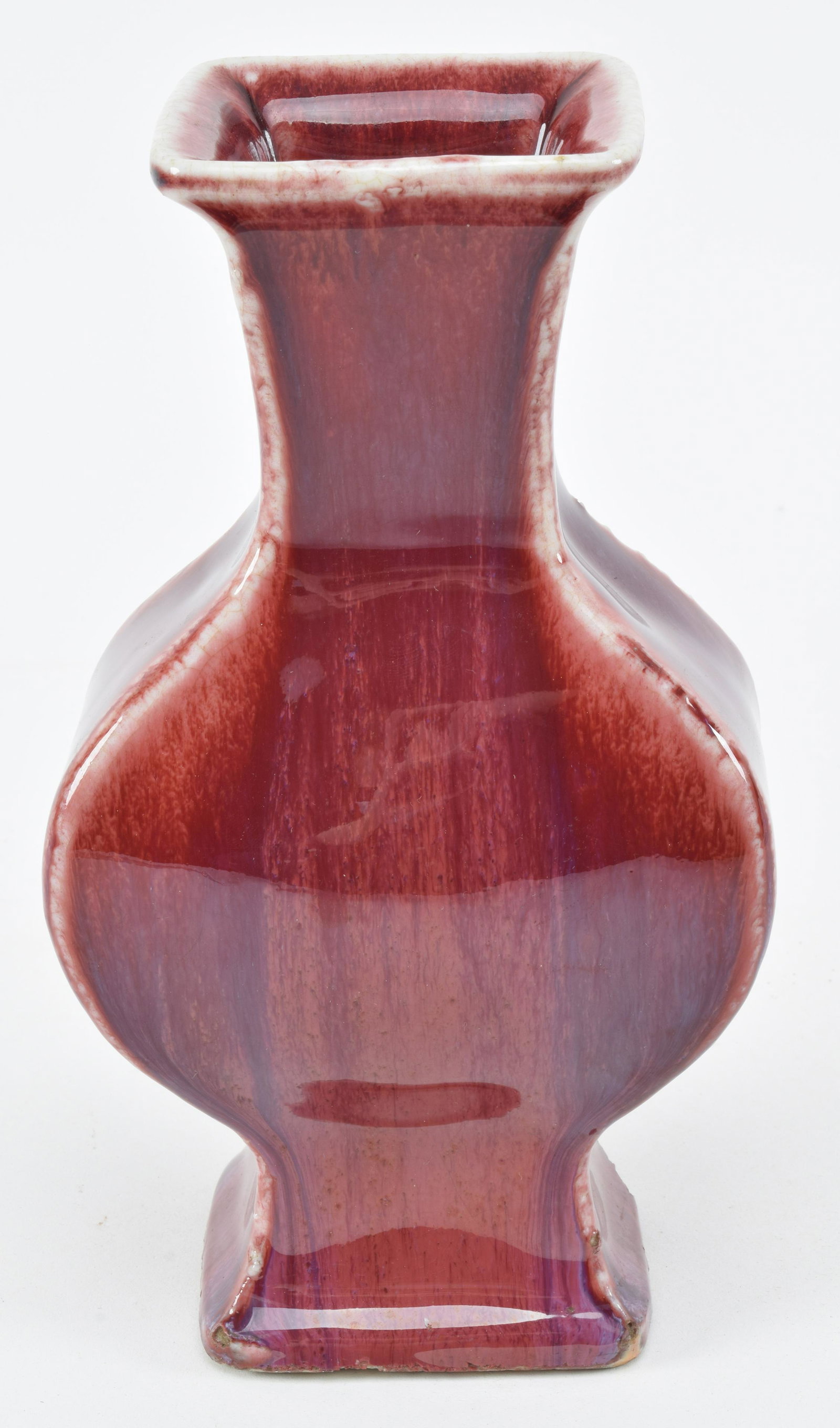 Oxblood vase. China. 20th century. Squared baluster: Oxblood vase. China. 20th century. Squared baluster form. Drilled to mounted as lamp. 8in high.